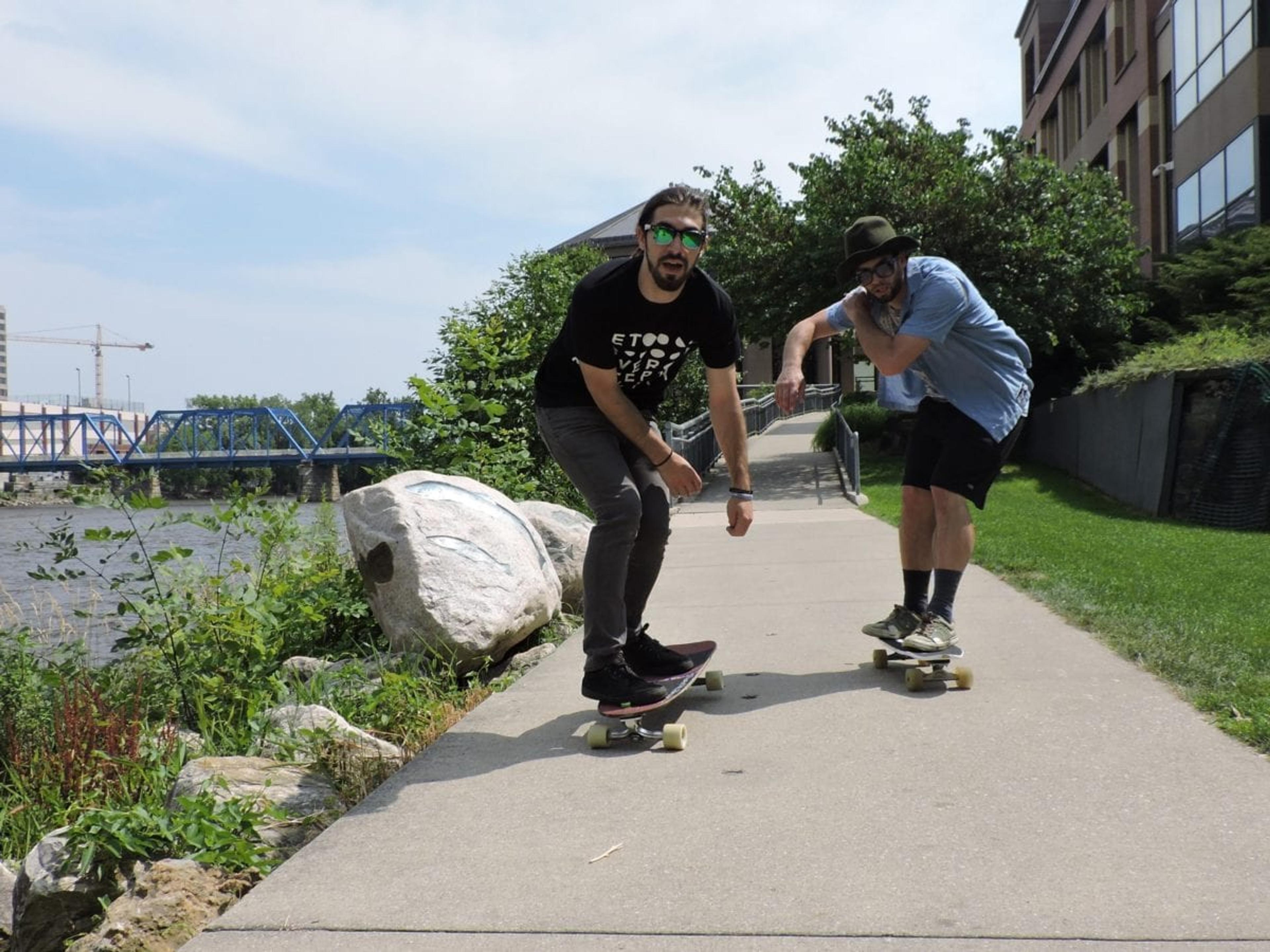 Ty Butler, left, and Mike Dallas, right, on an afternoon ride along the Grand River. 