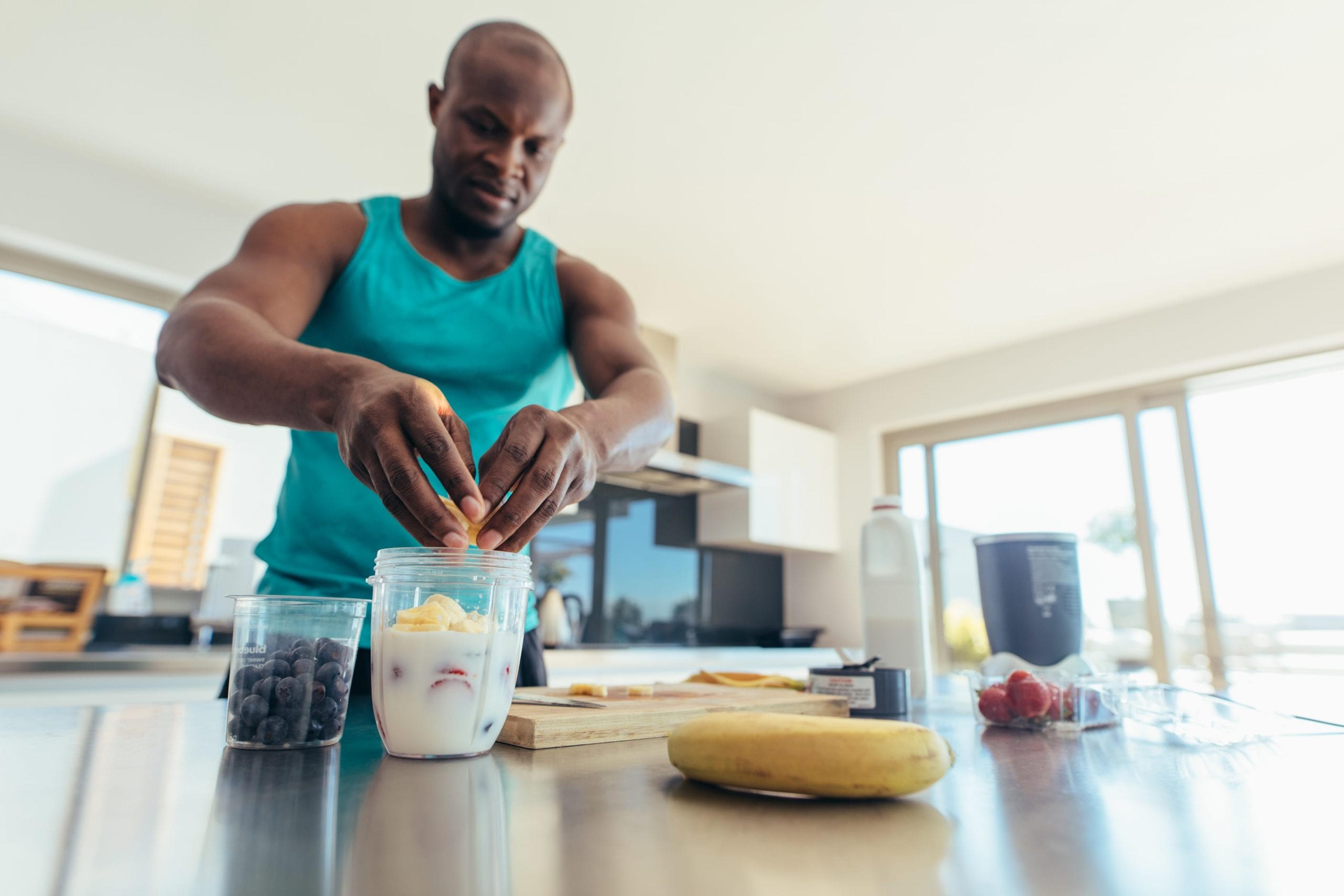 Man making a workout smoothie