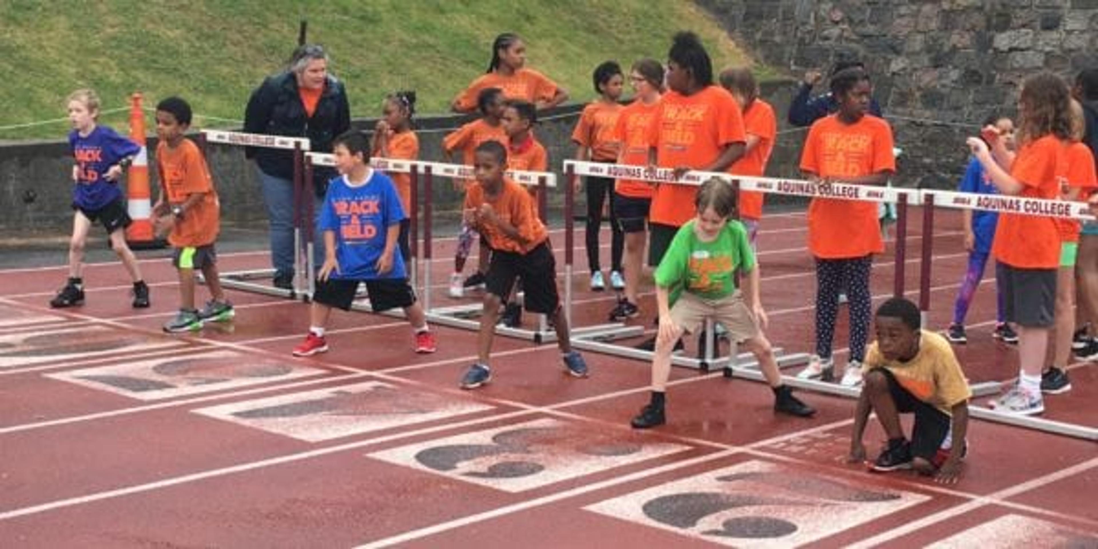 Grand Rapids Public Schools track athletes at the starting line of a race.