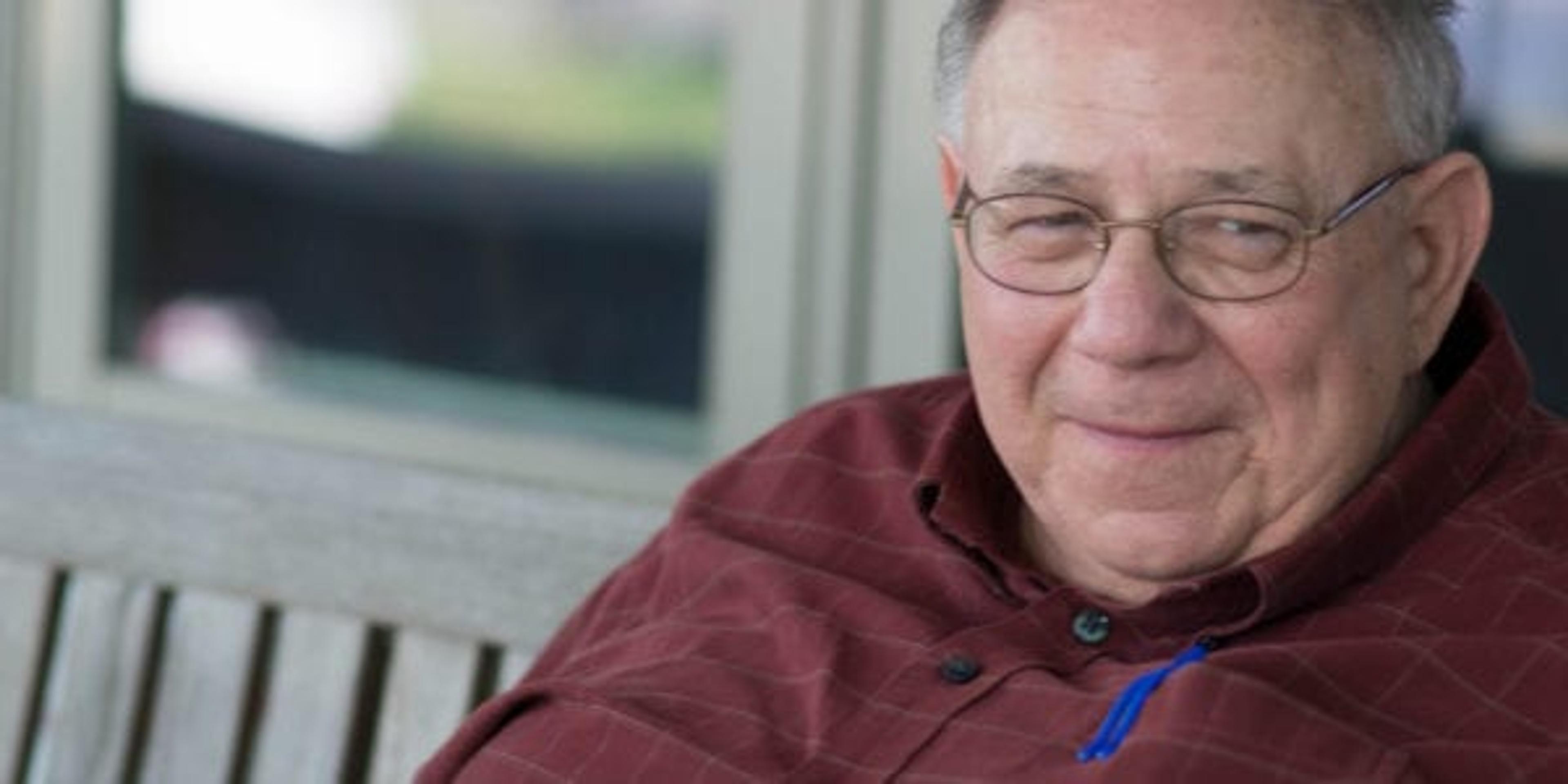 Grandpa sitting on a porch