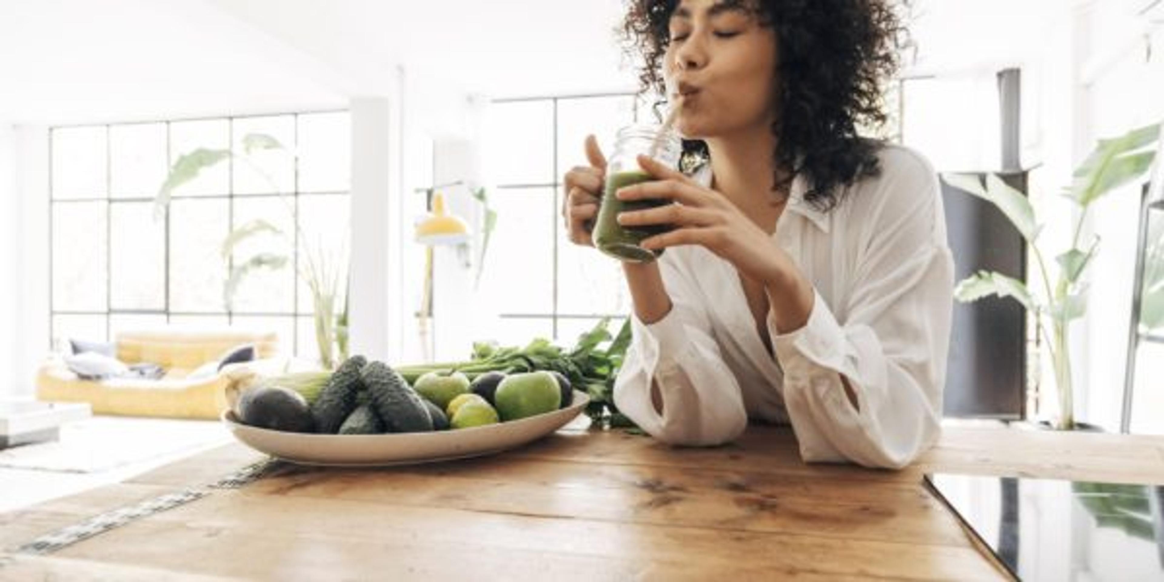 Young woman drinking a smoothie