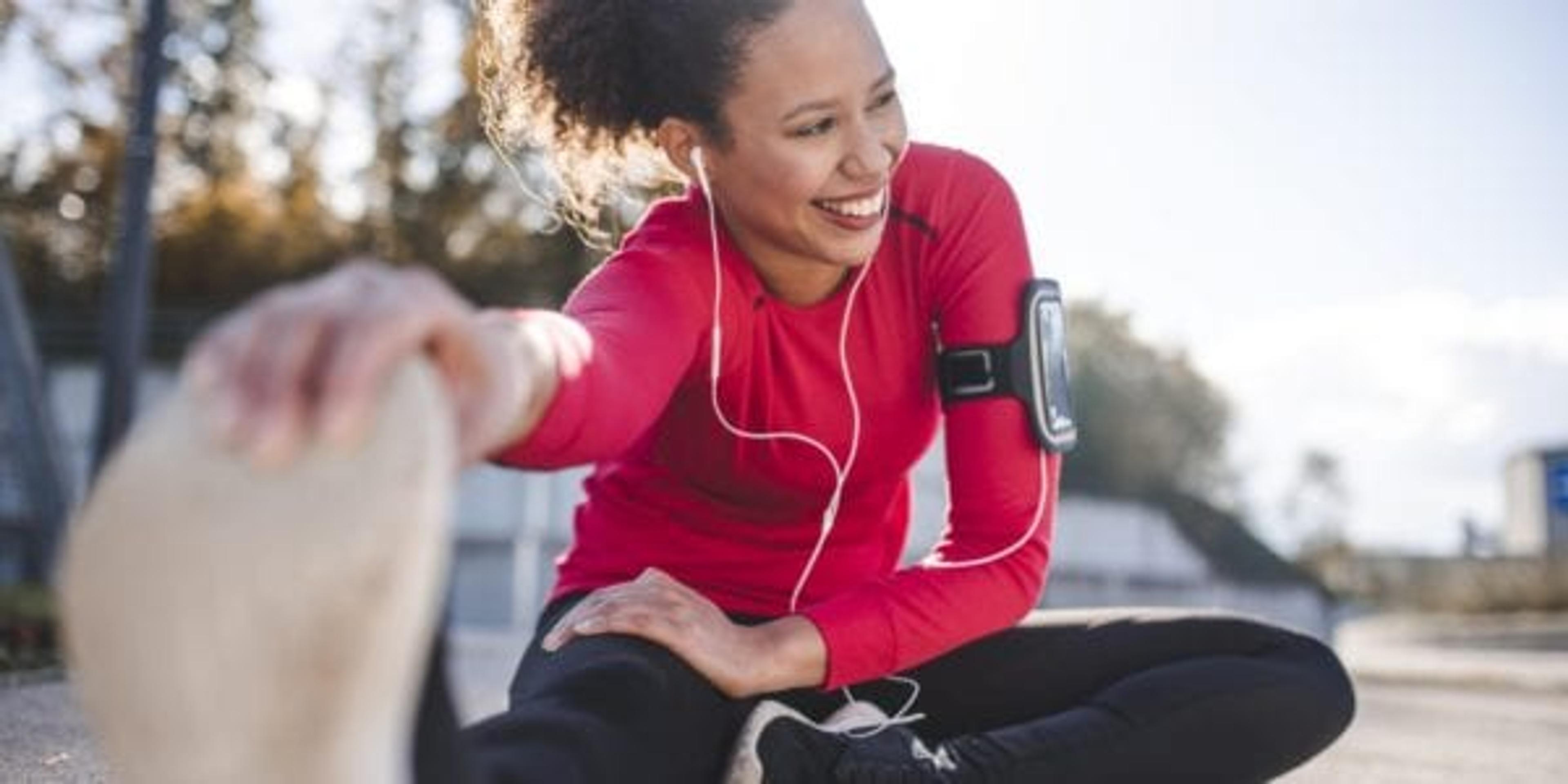 Woman stretching by reaching for her toes
