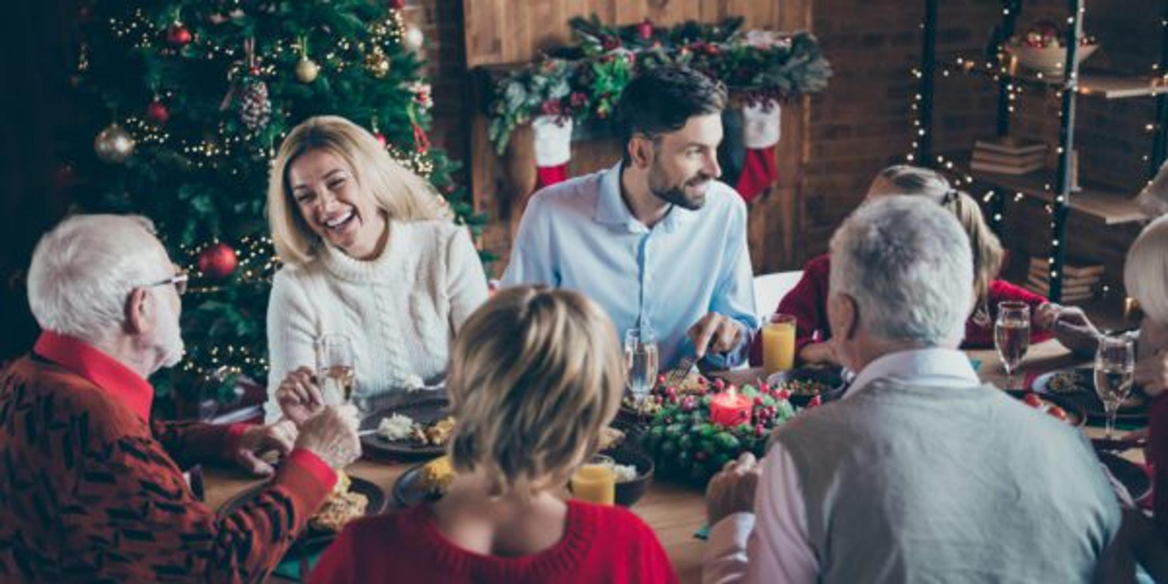 Family gathering around the table discussing restrictive eating during the holidays