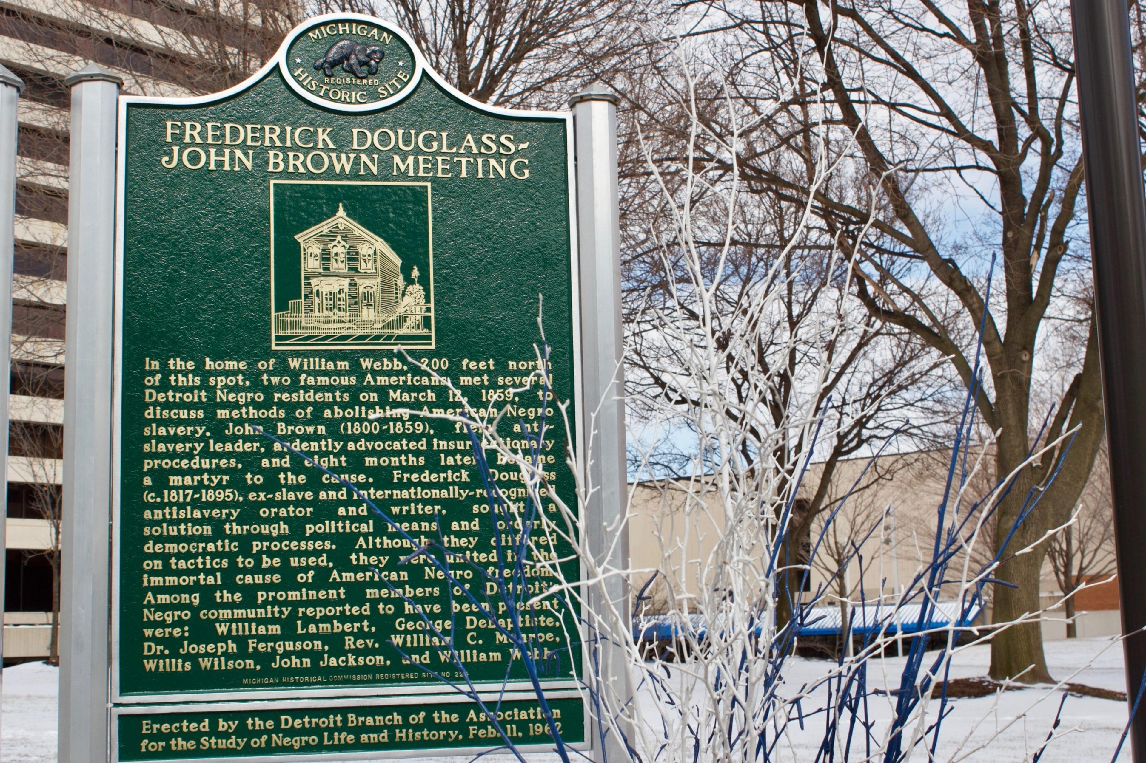 Image of historical marker showcasing meeting between abolitionists Frederick Douglass and John Brown.