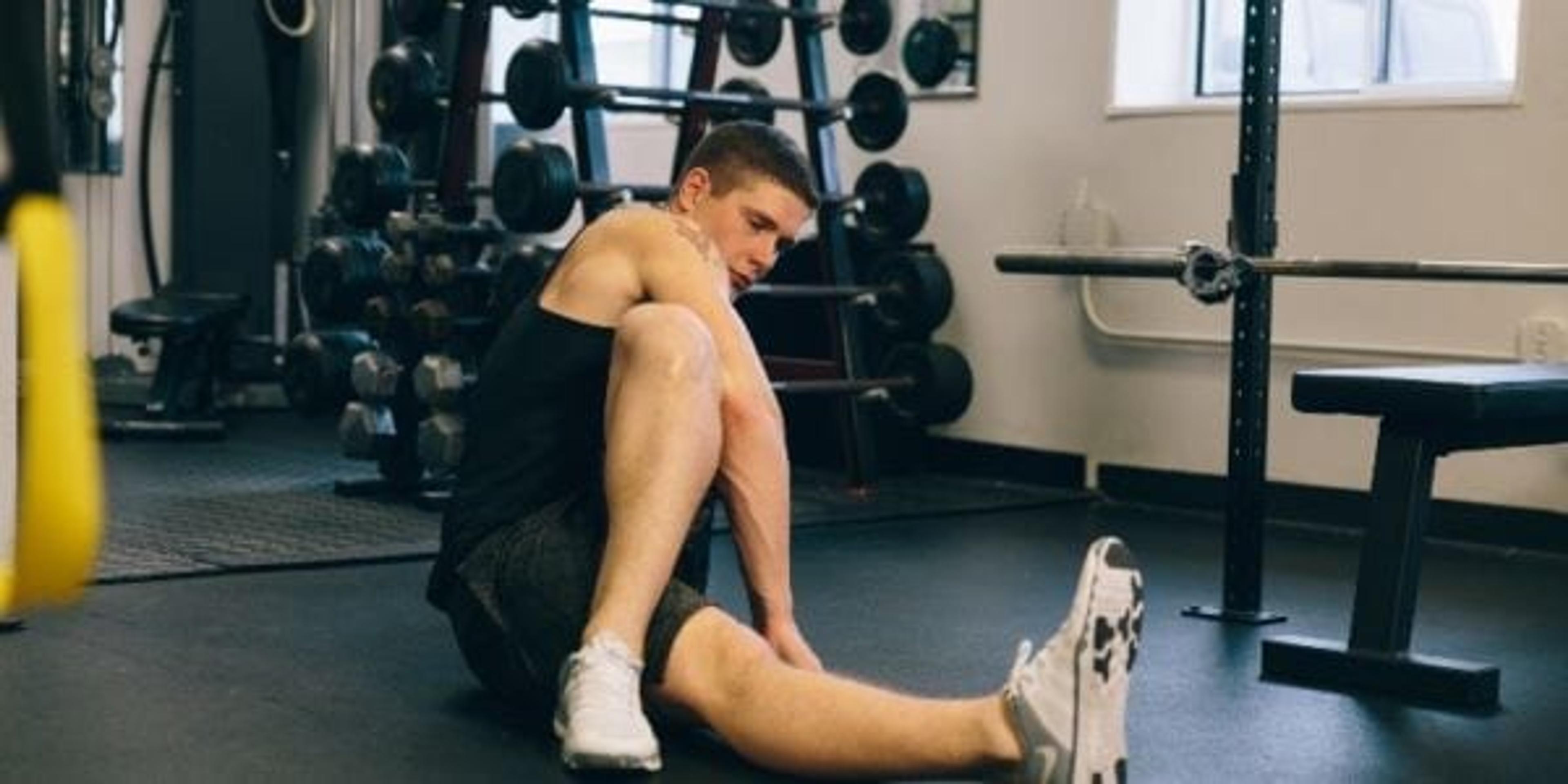 Man on floor stretching