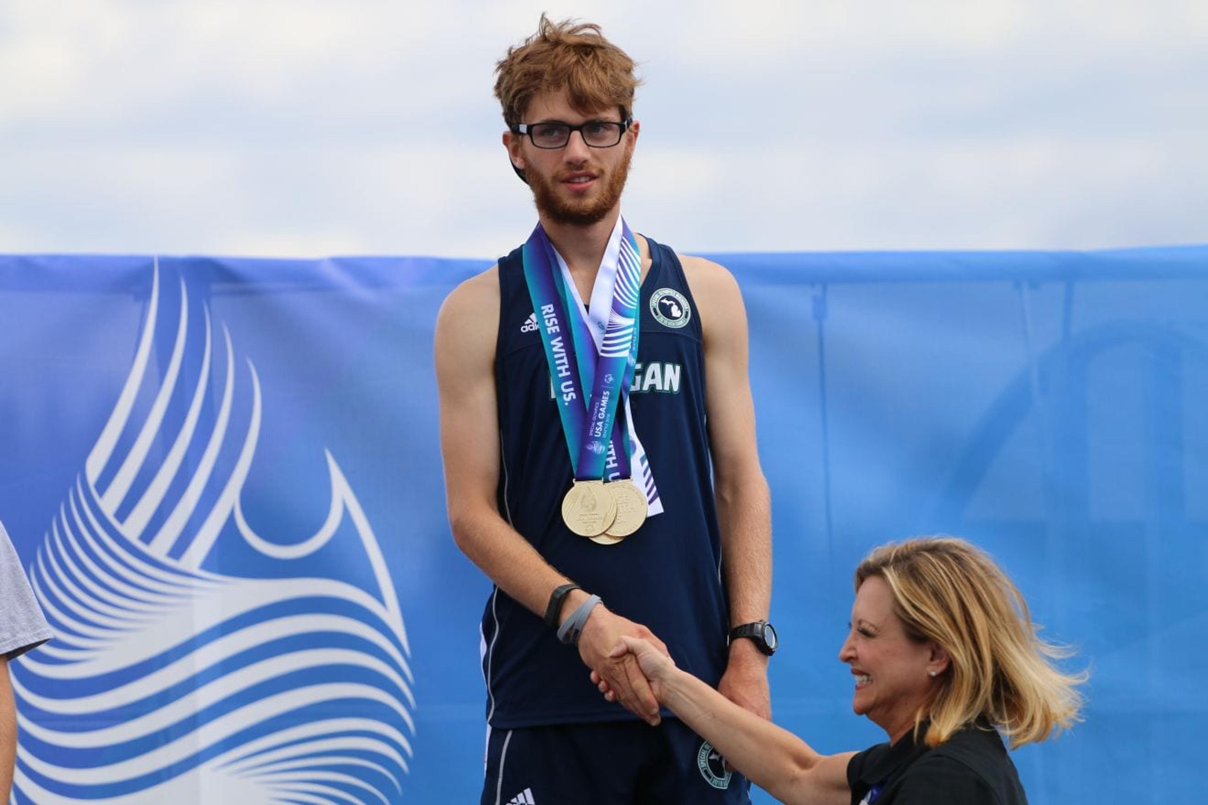 Julian Borst receiving his medals at the 2018 Special Olympics USA Games