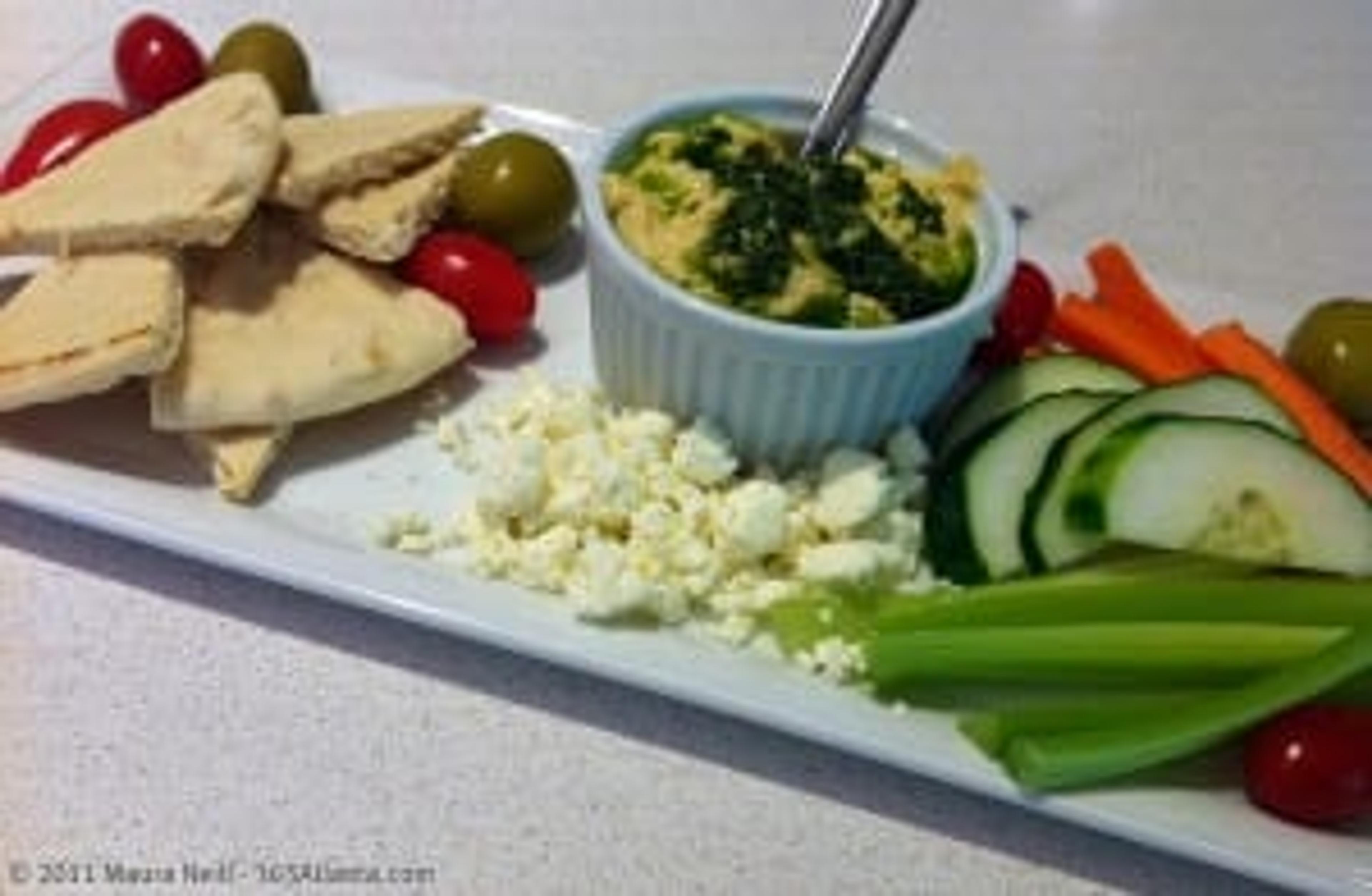 Mediterranean platter with hummus, pita wedges and veggies