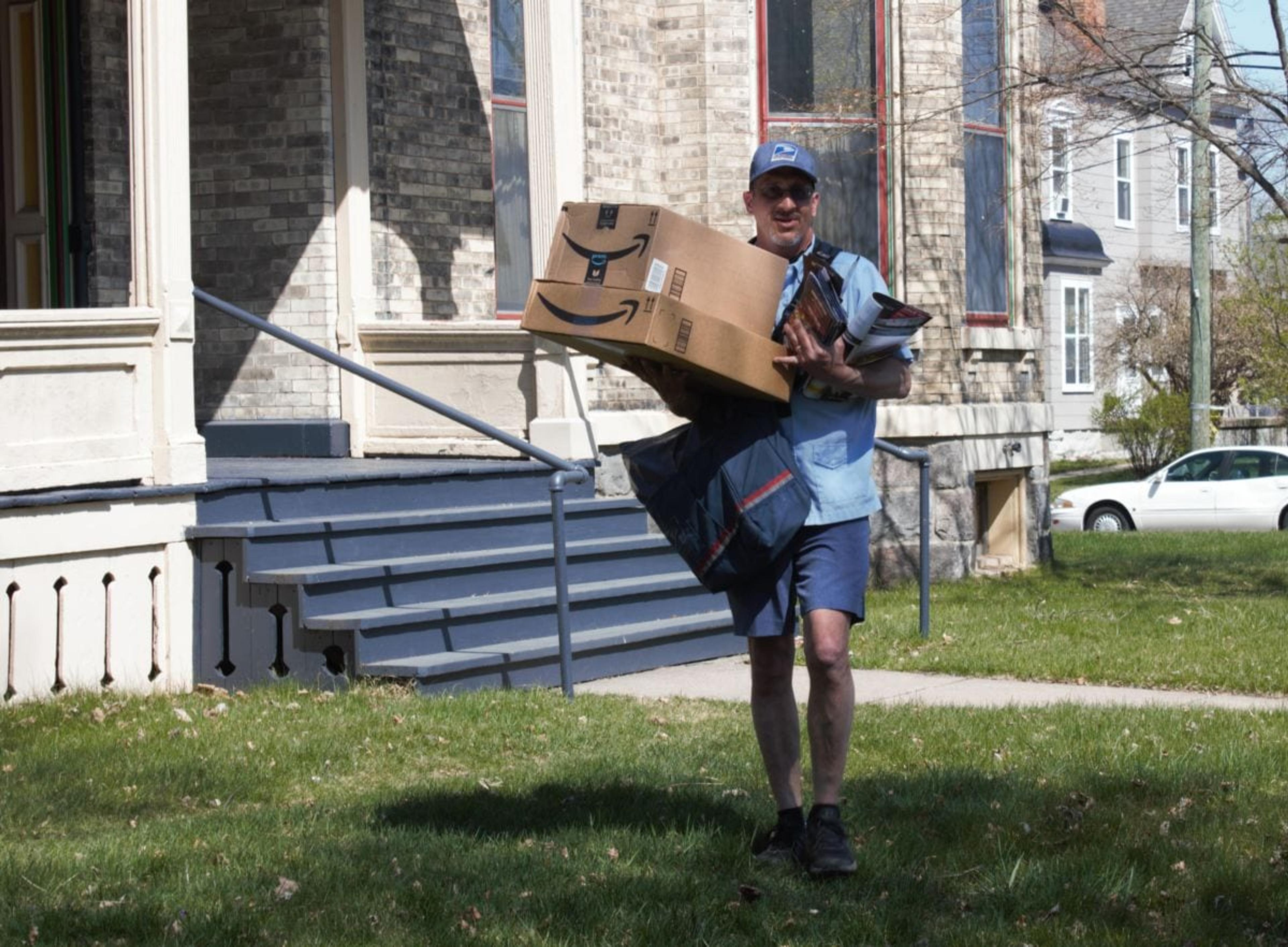 Ron Kammers delivering mail on his Heritage Hill route. 