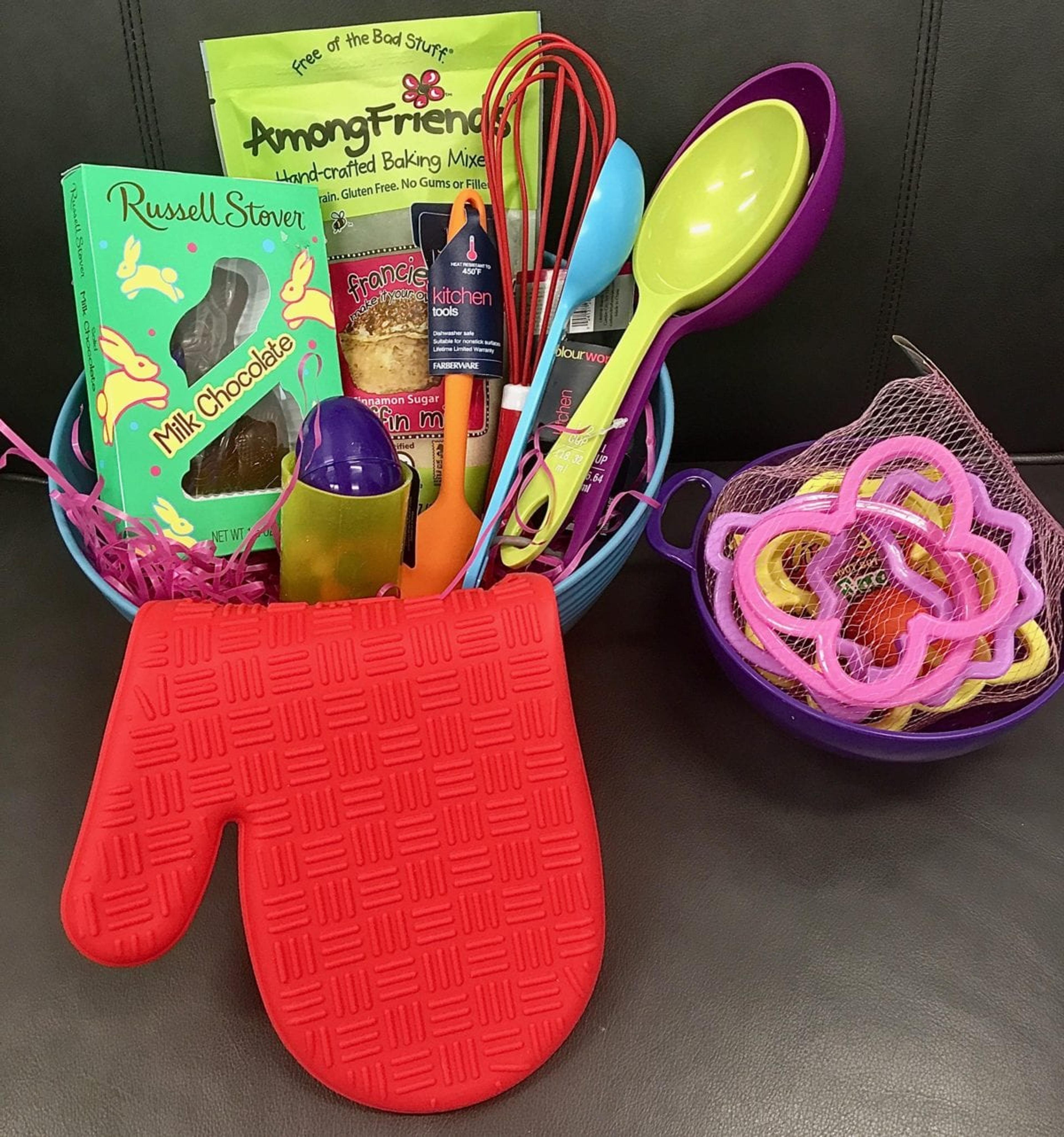 cooking easter basket with kitchen gadgets like whisk and measuring cups