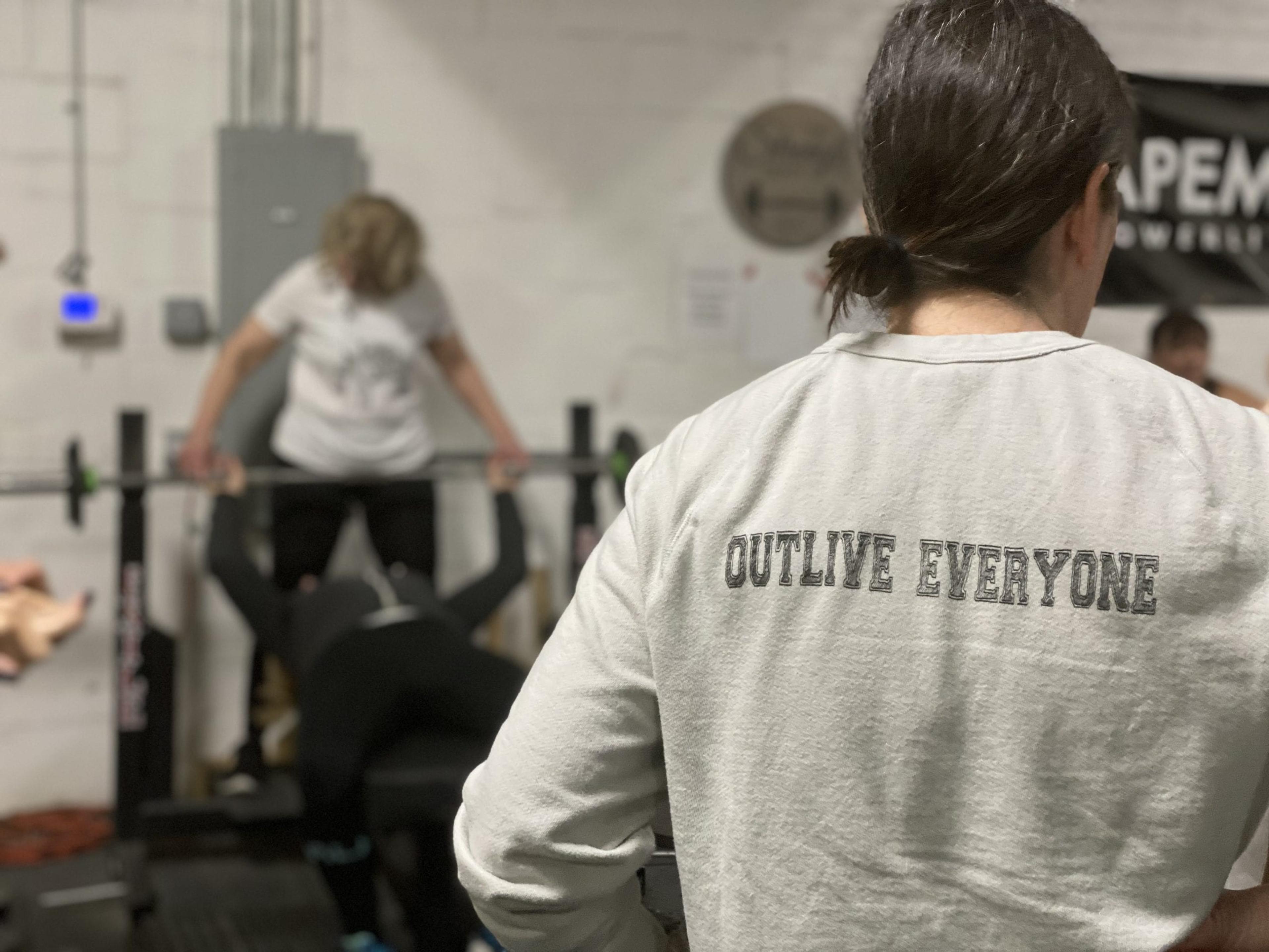 Women powerlifting at the gym