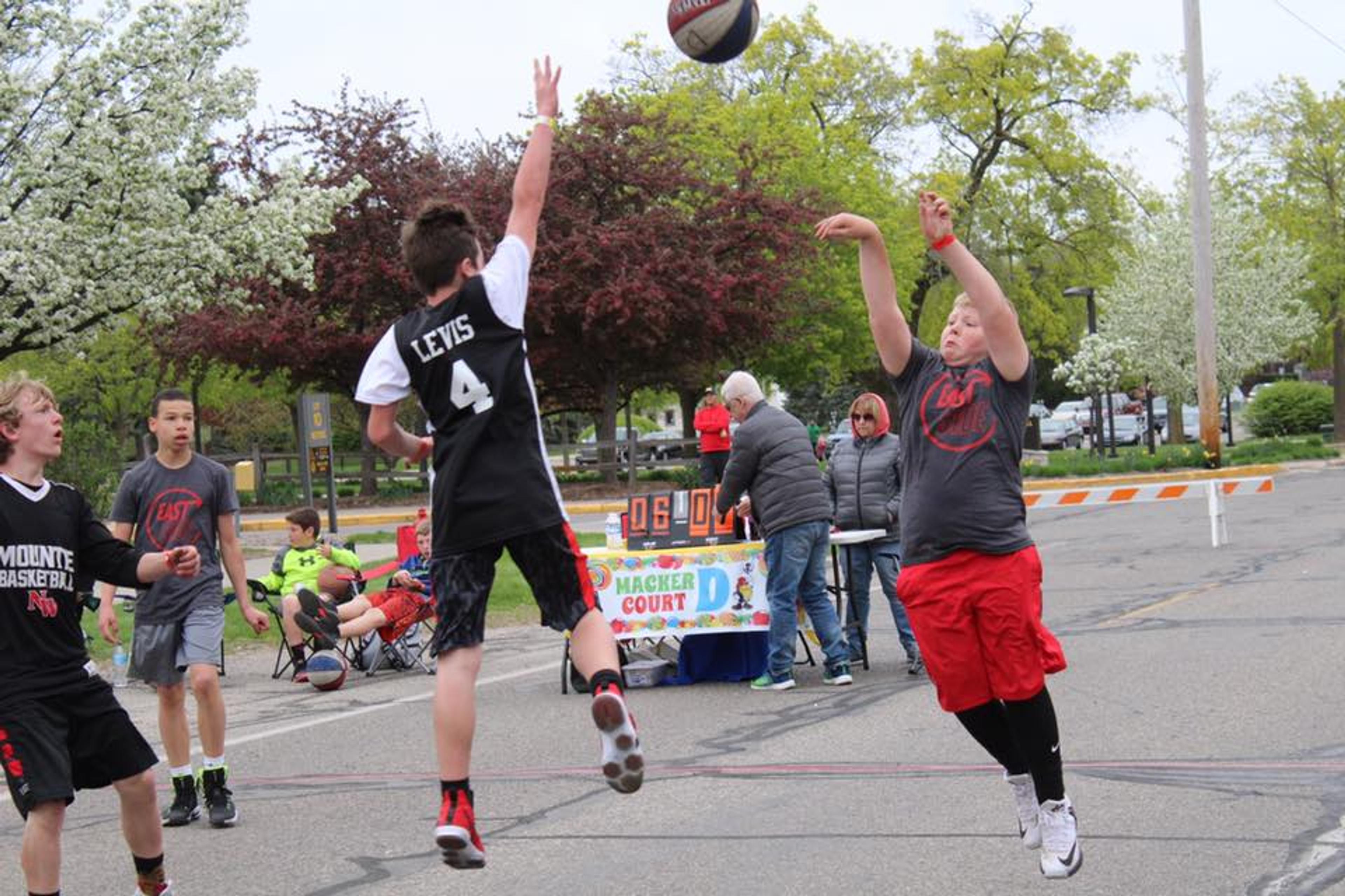 Two boys playing basketball