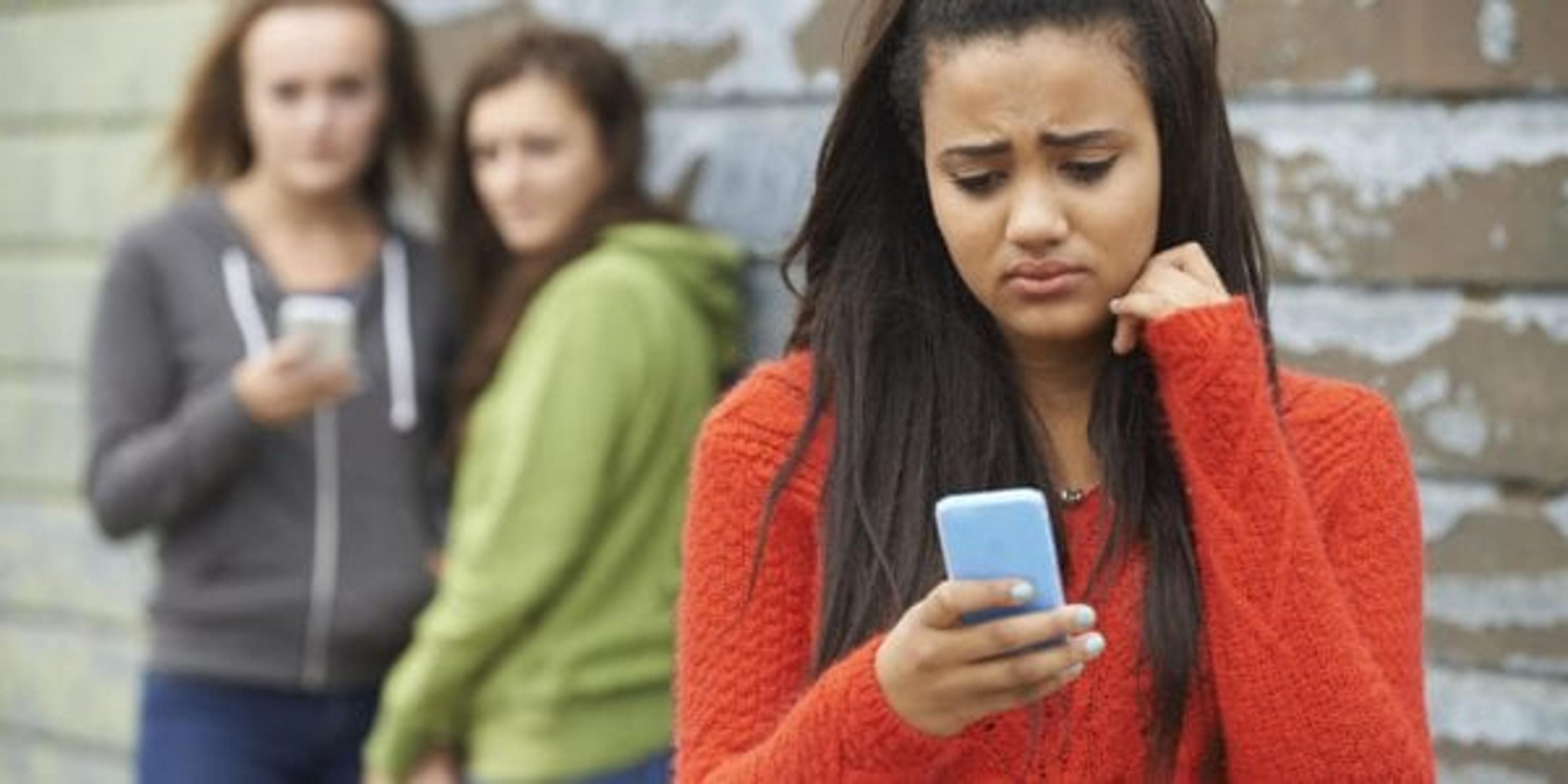 Teen girl being bullied online