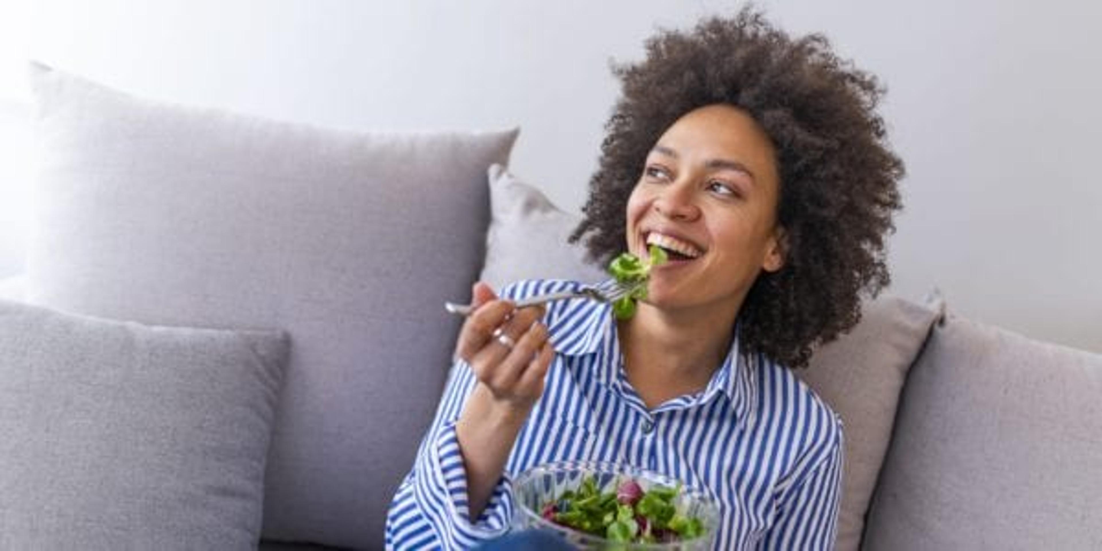 Woman eating salad