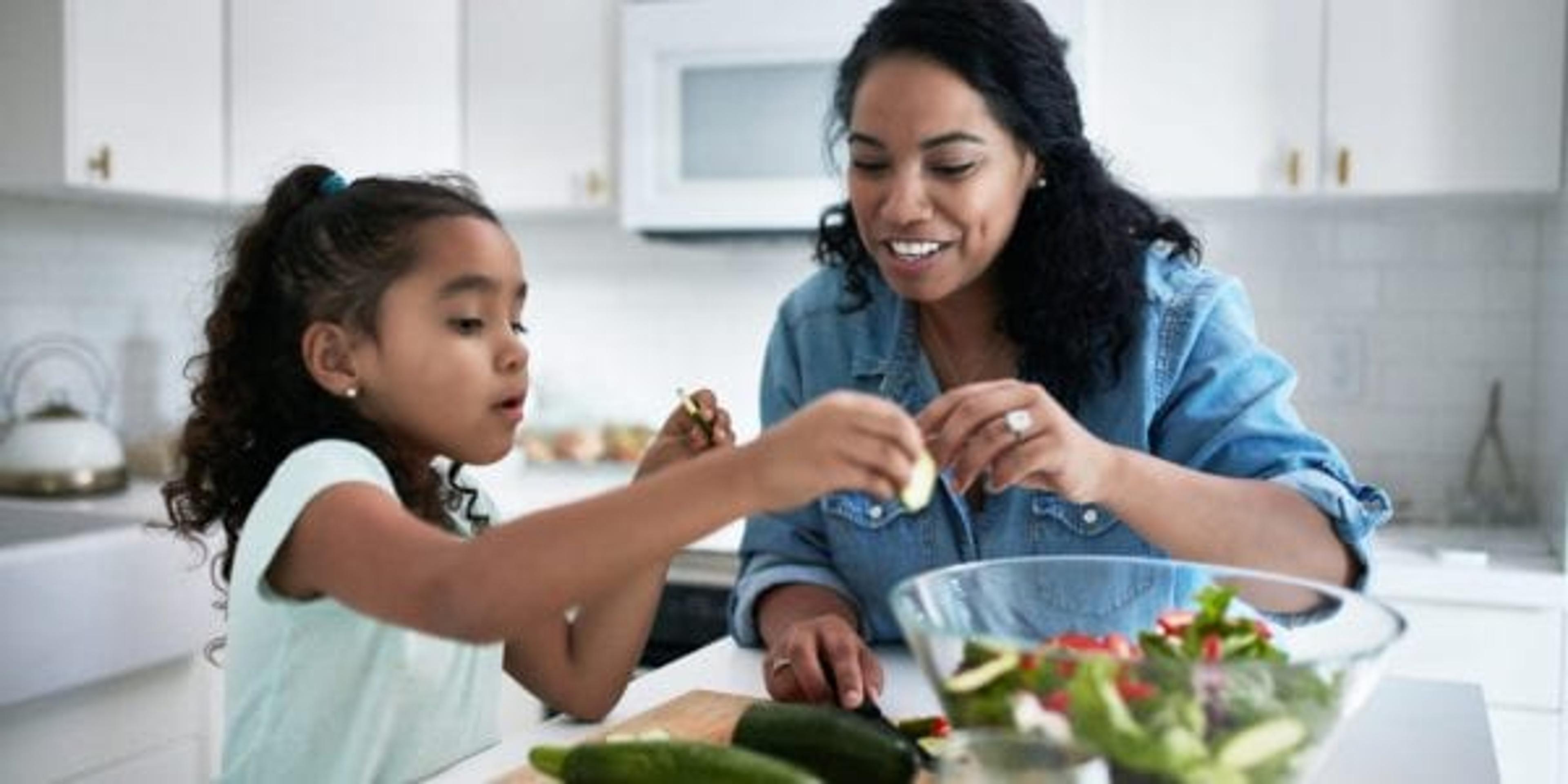 Mom making lunch with her daughter