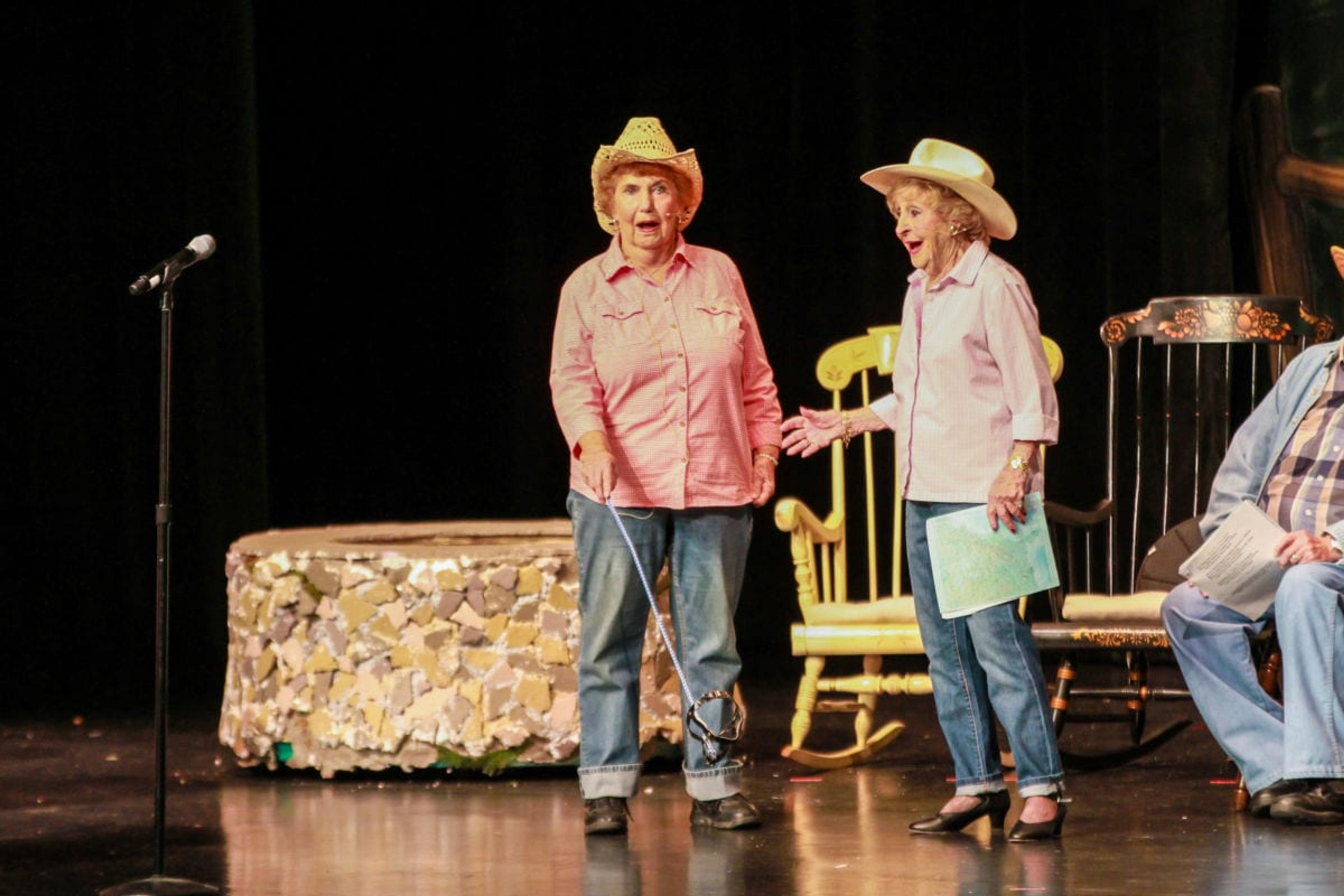 two seniors singing onstage