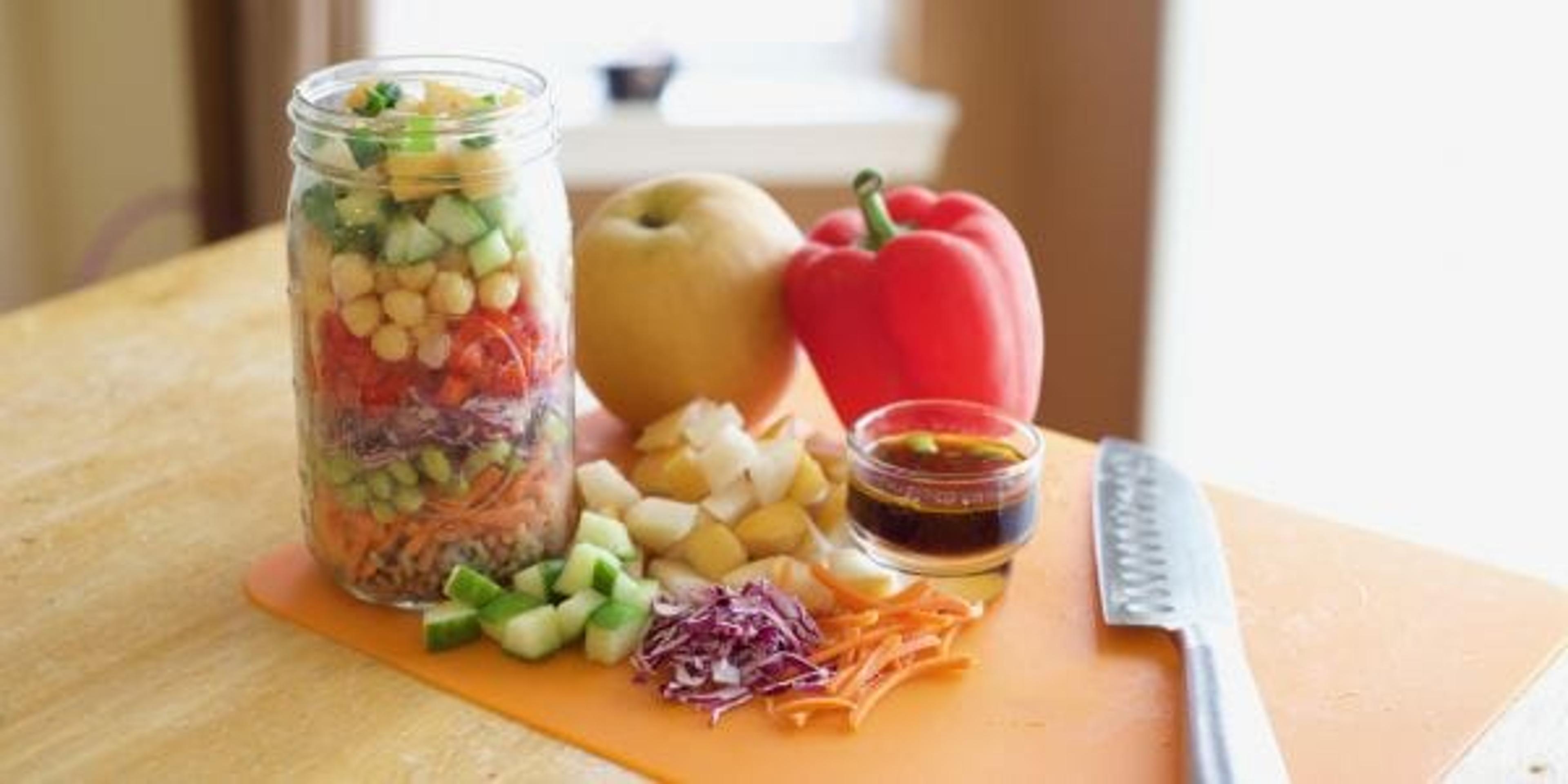Mason jar salad with vegetables and dressing