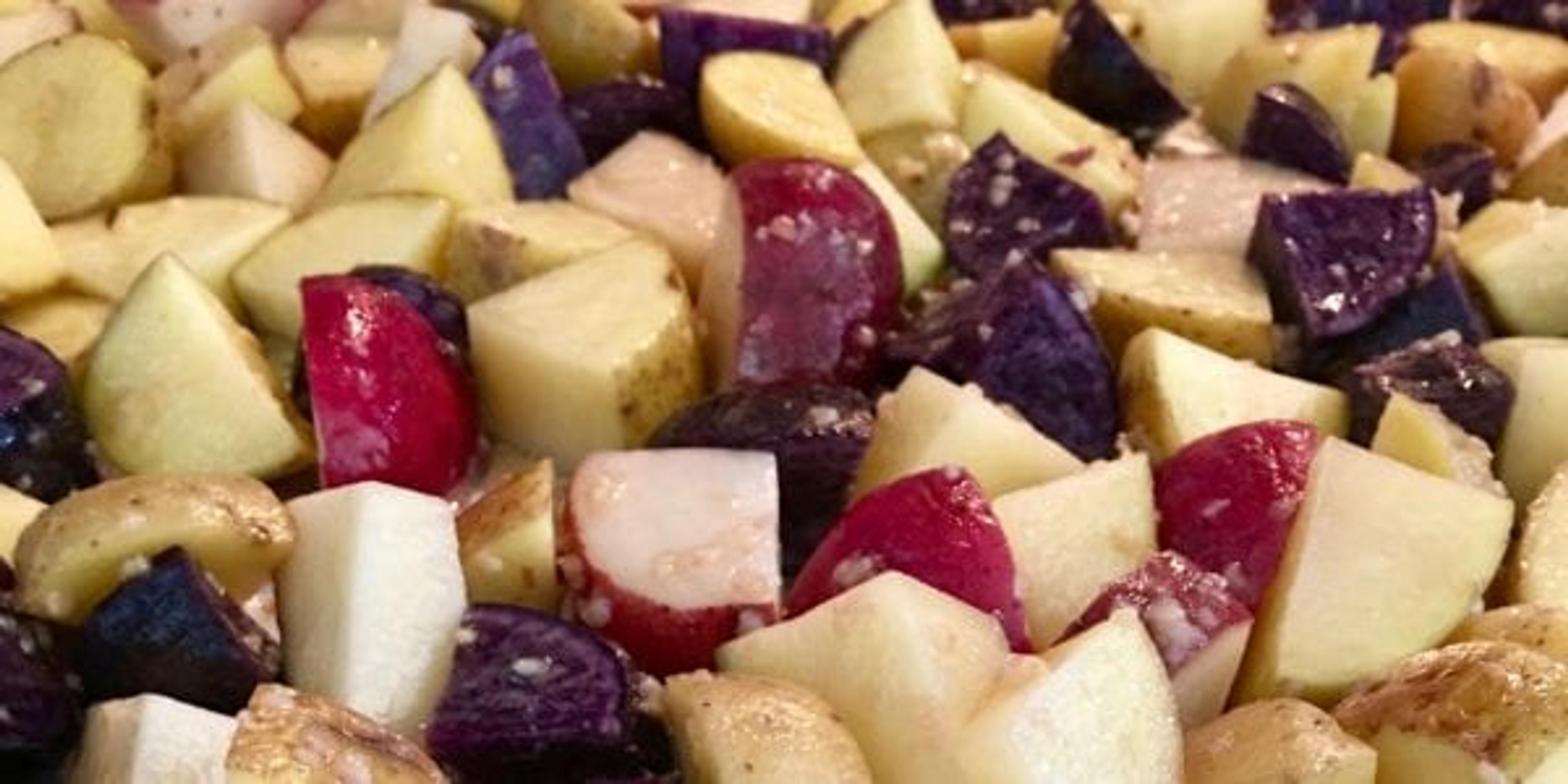 Chopped potatoes on a baking sheet