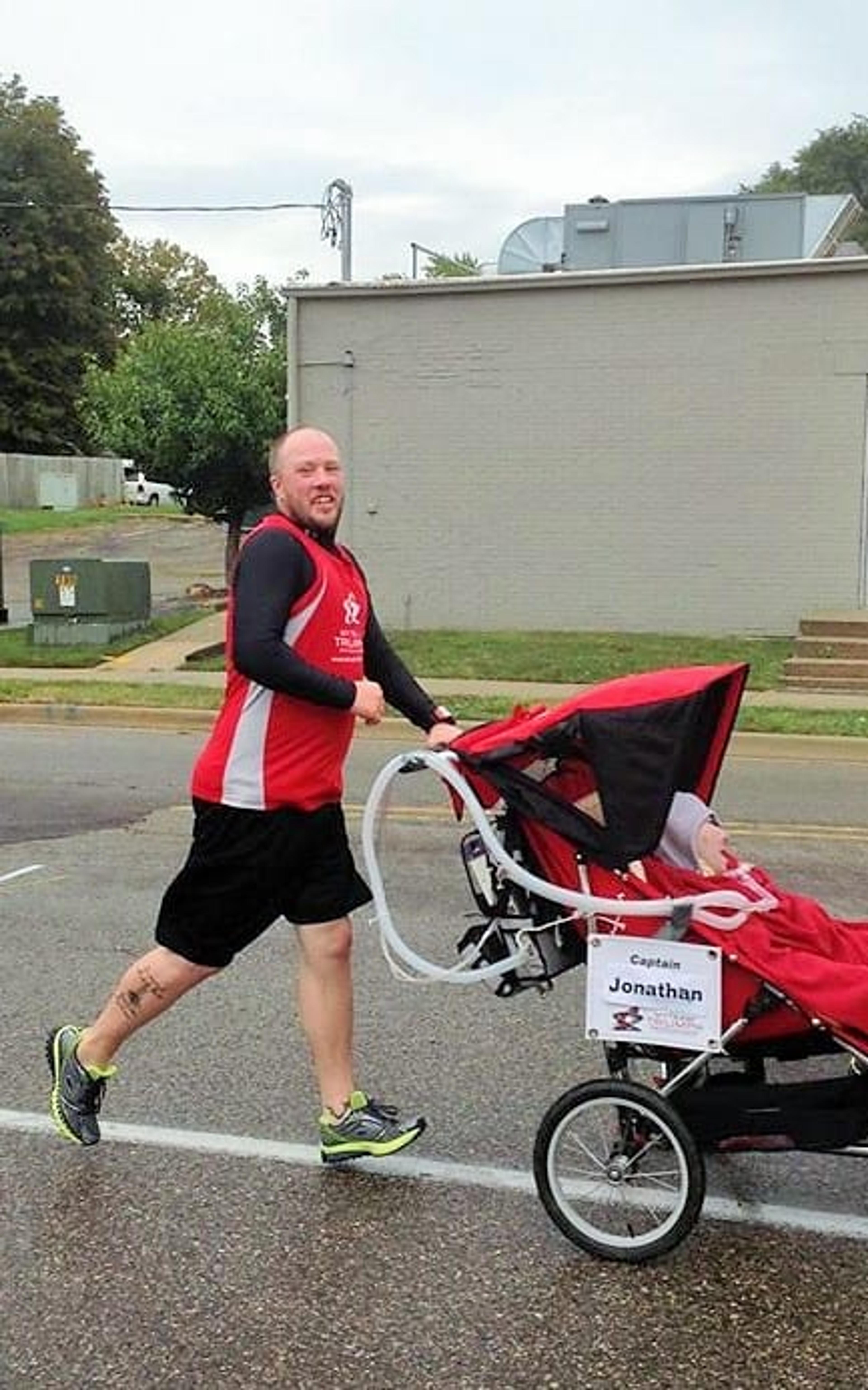 Tom Popma running as a Team in Triumph "angel" during the 2013 Bridge Run. 