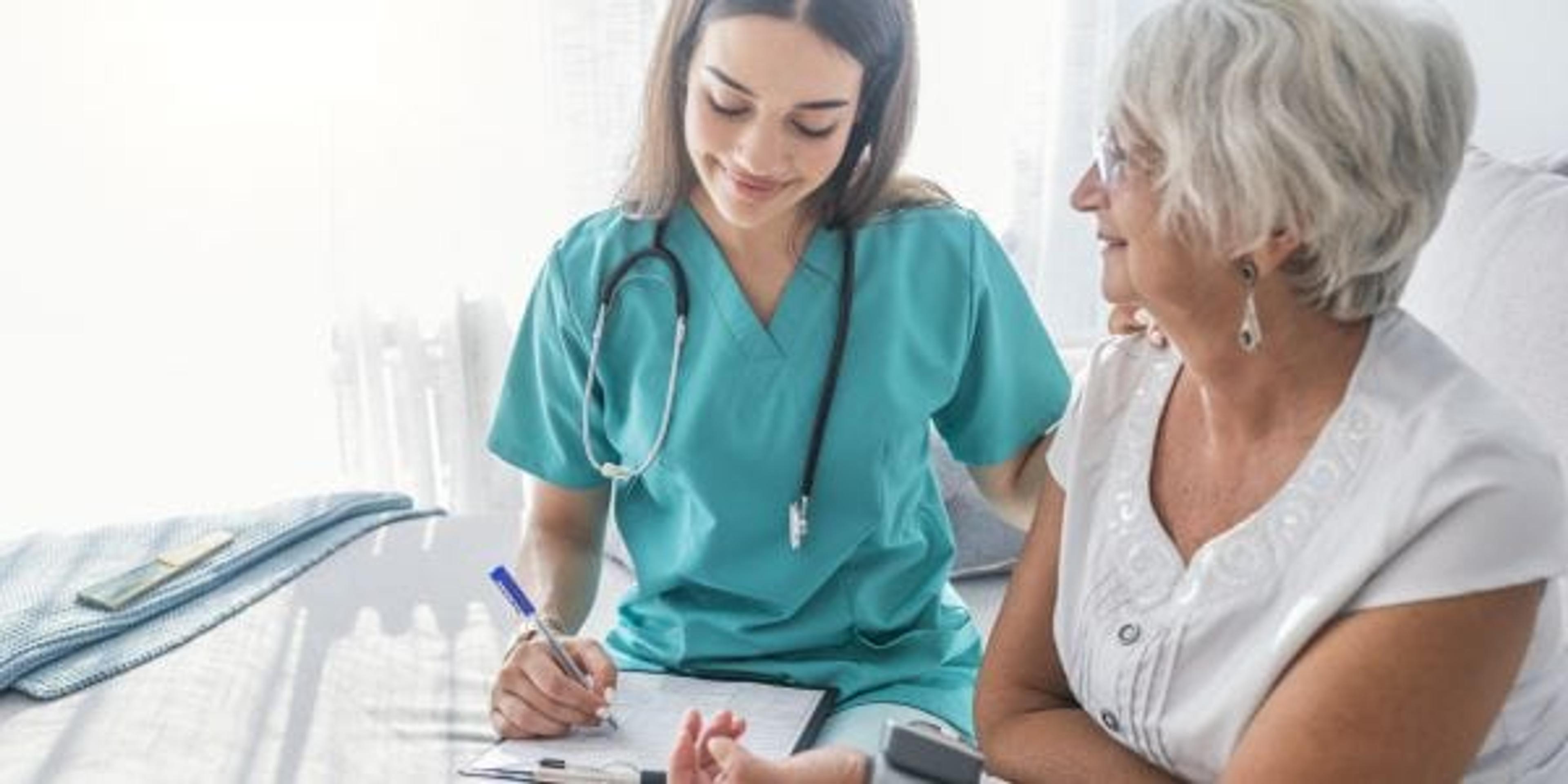 Nurse measuring a woman's blood pressure.