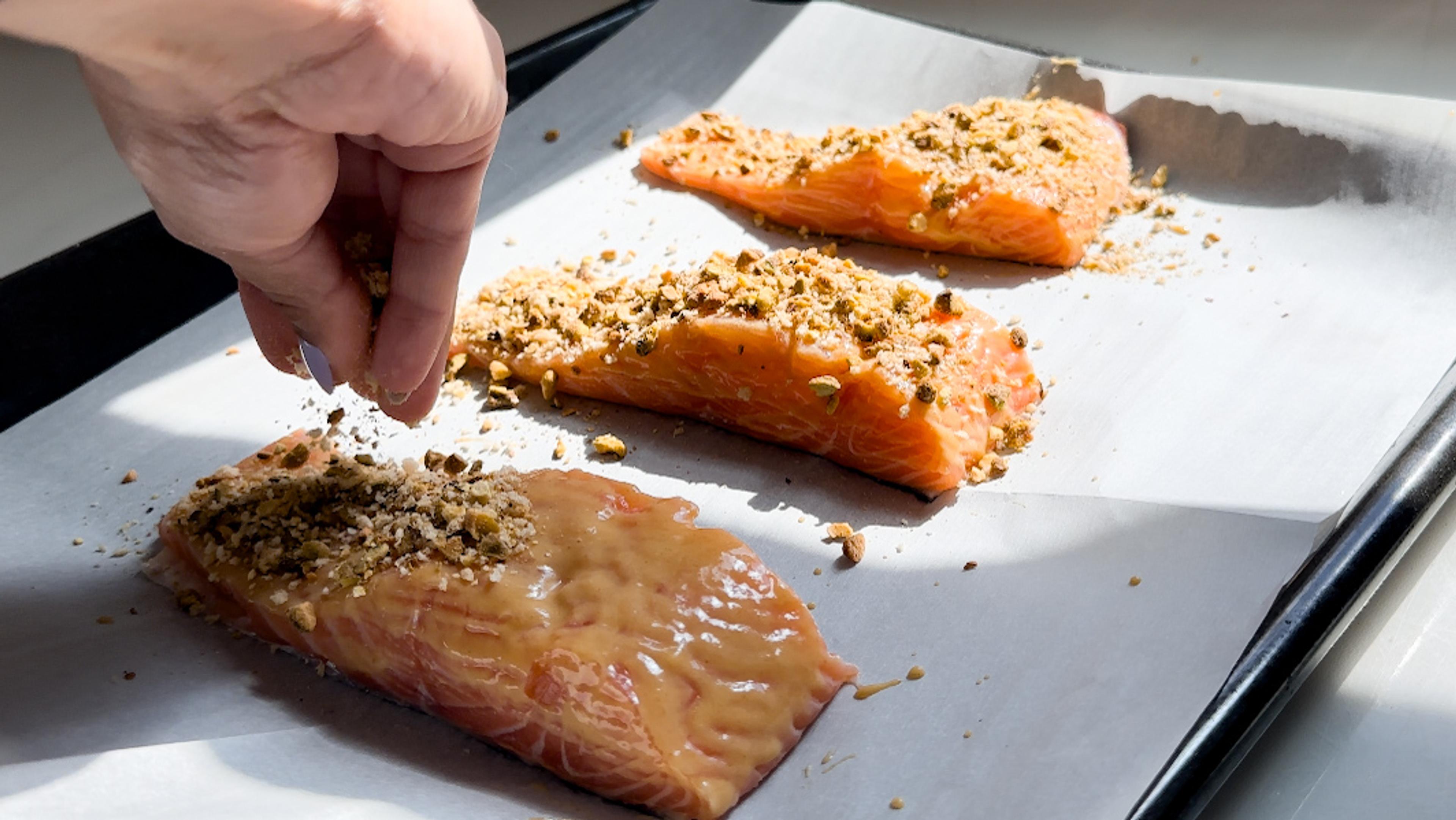 Pour over the pistachio mixture over the salmon, pressing down to allow it to stick. Place on a lined baking sheet.