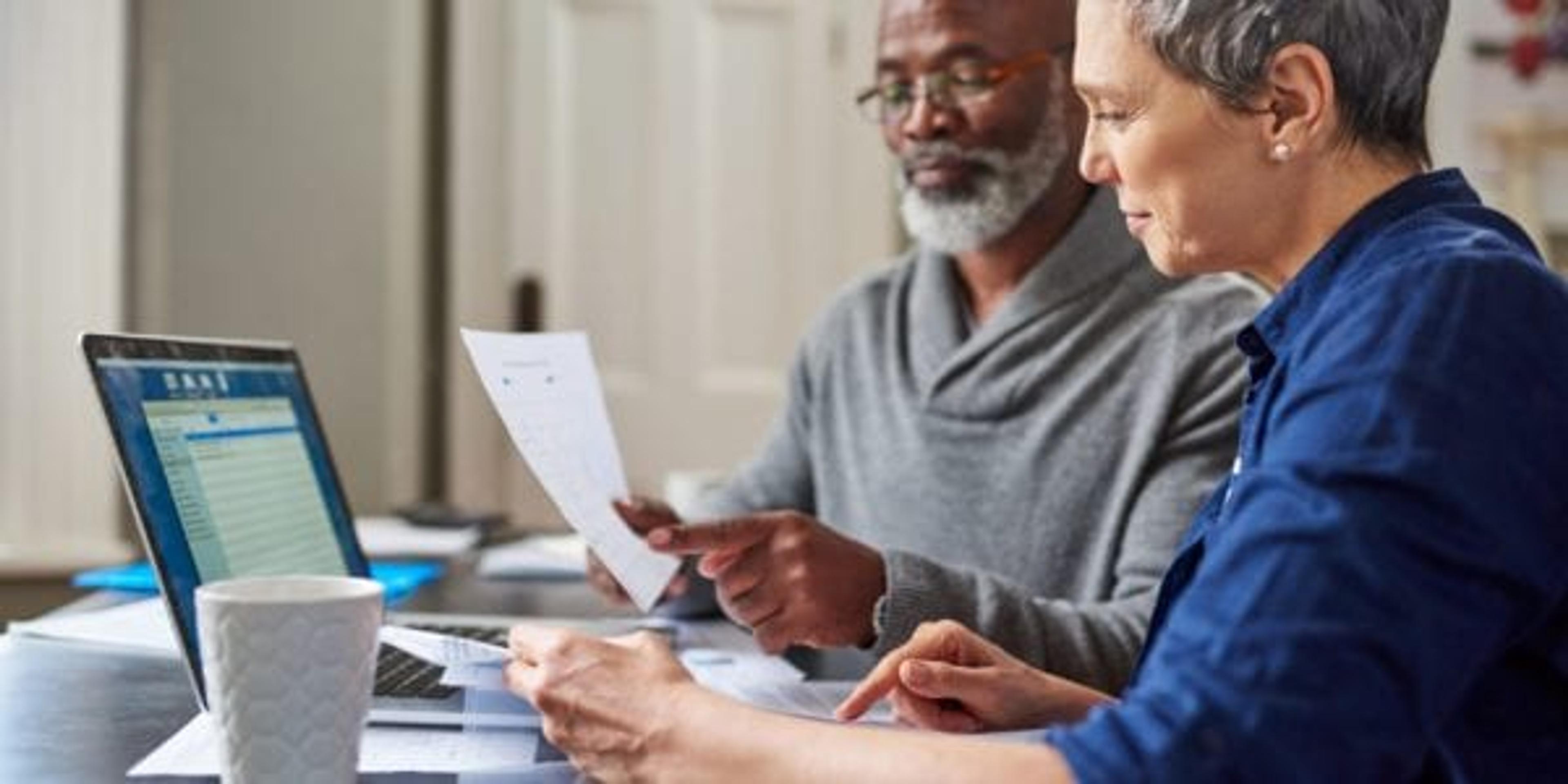 senior couple working on their finances at home