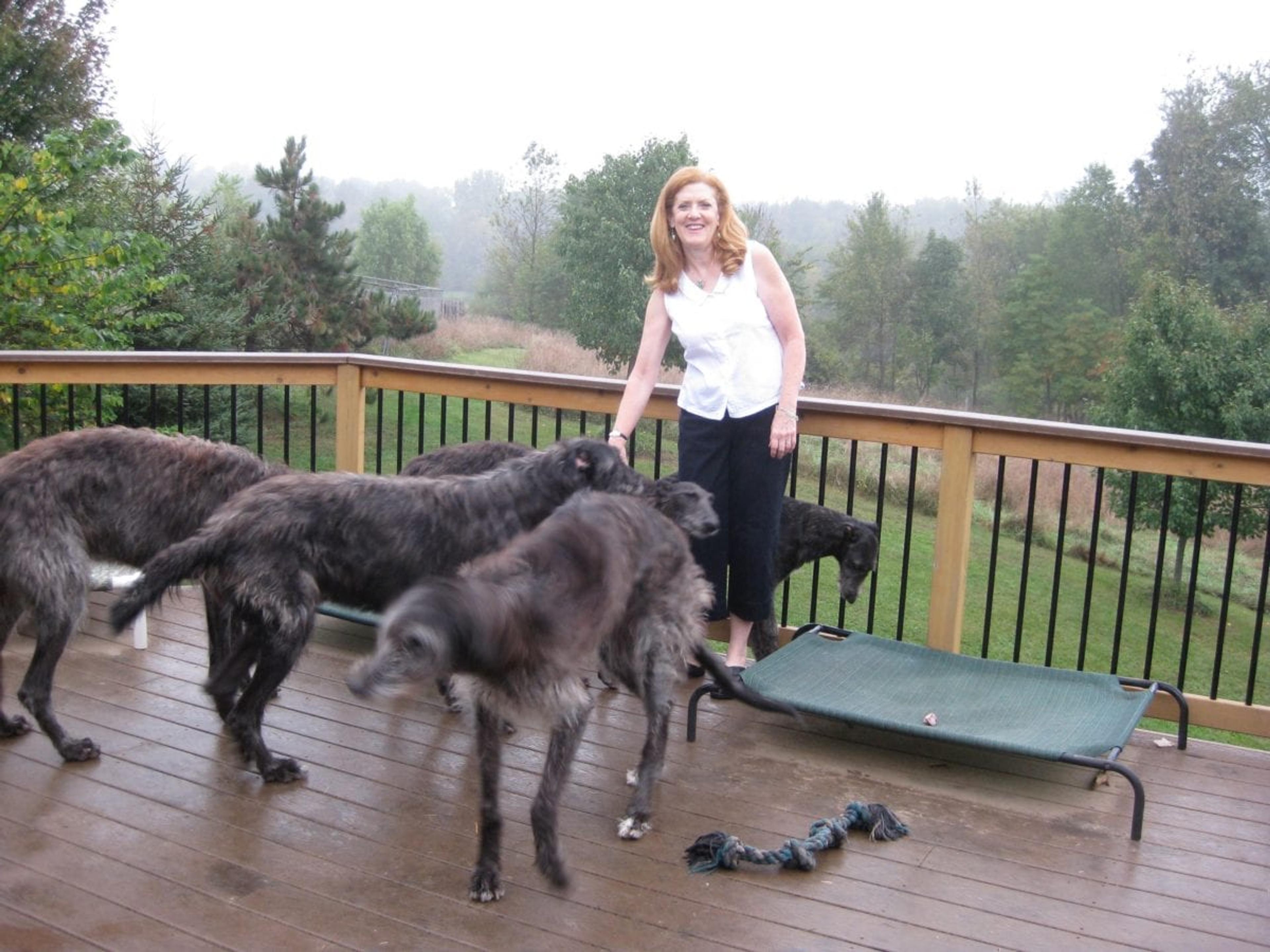 2009 ArtPrize artist Beth Shadur enjoying Margaret Sudekum's dogs.