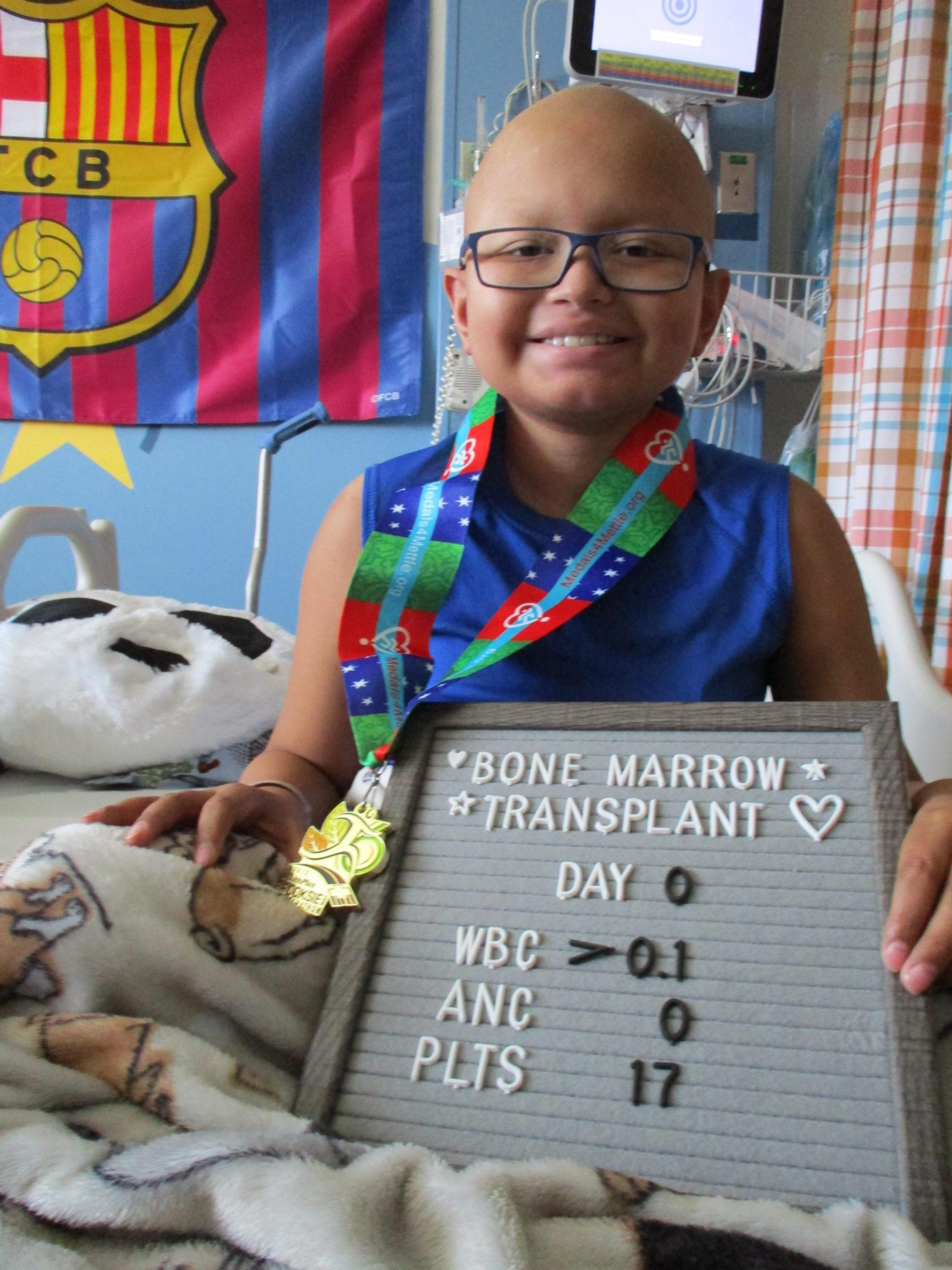 A Medals4Mettle recipient smiling after receiving her medal.