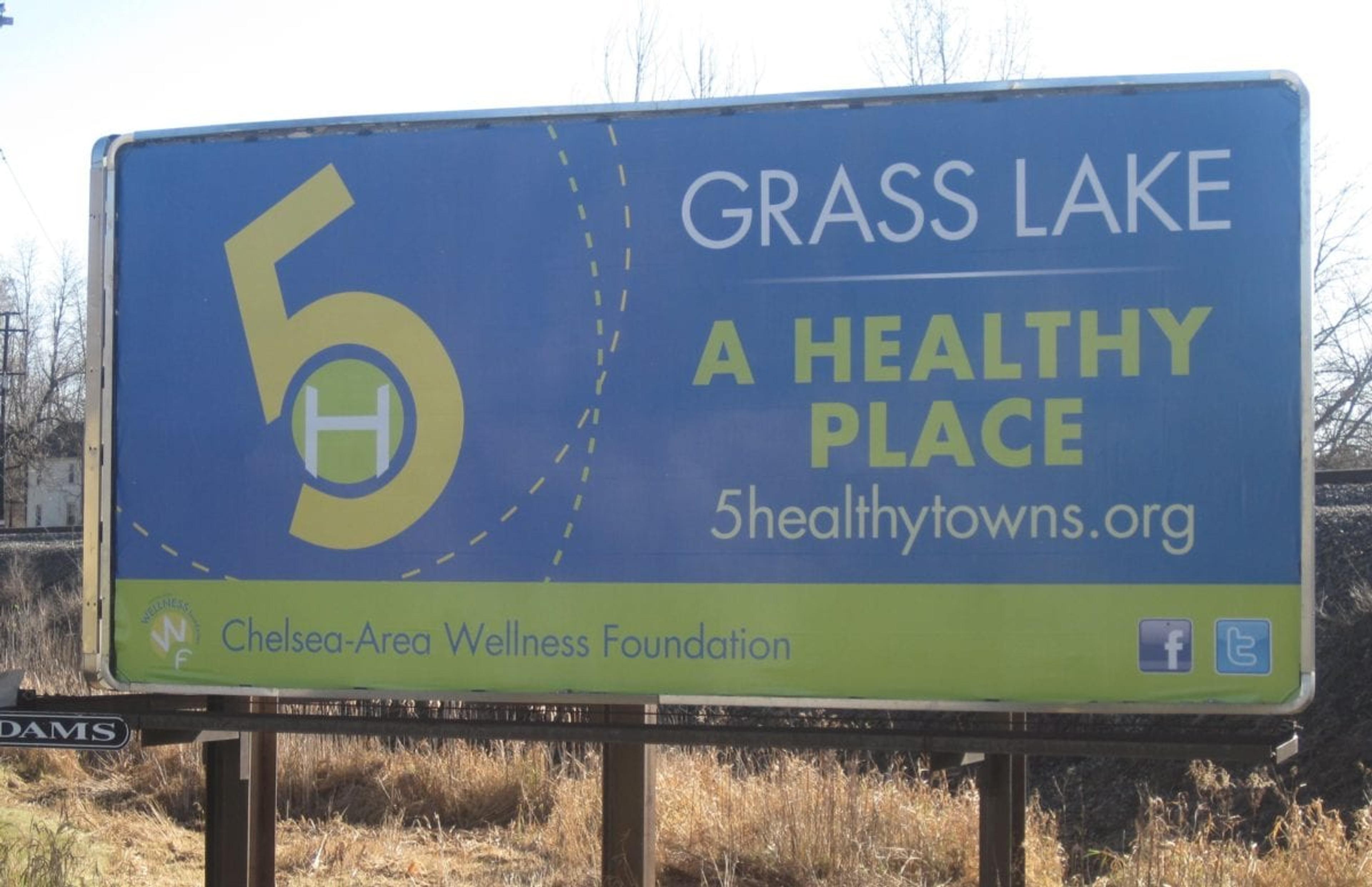City sign for Grass Lake's sponsorship by 5 Healthy Towns Foundation. 