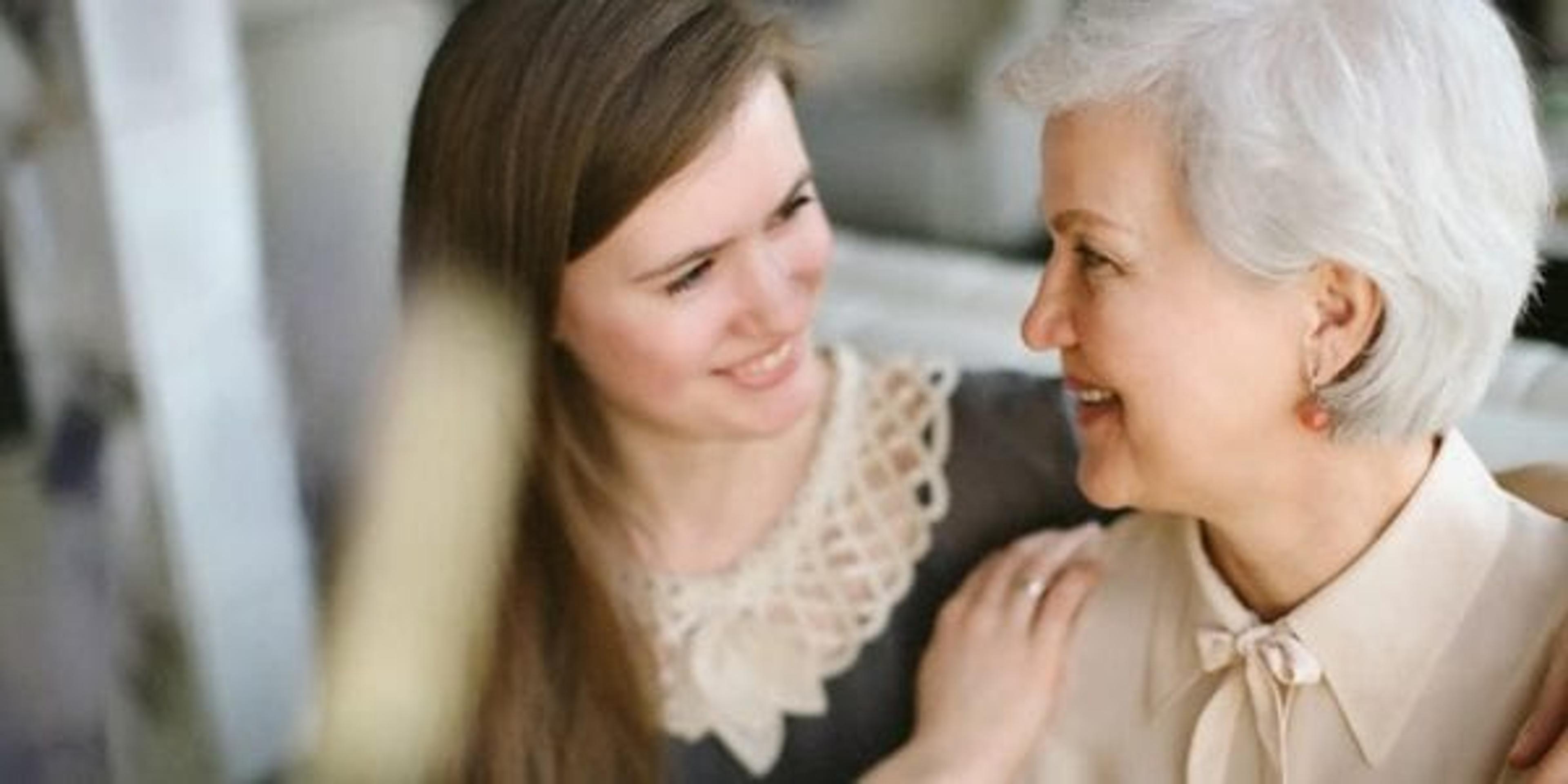 Young woman and older woman smiling