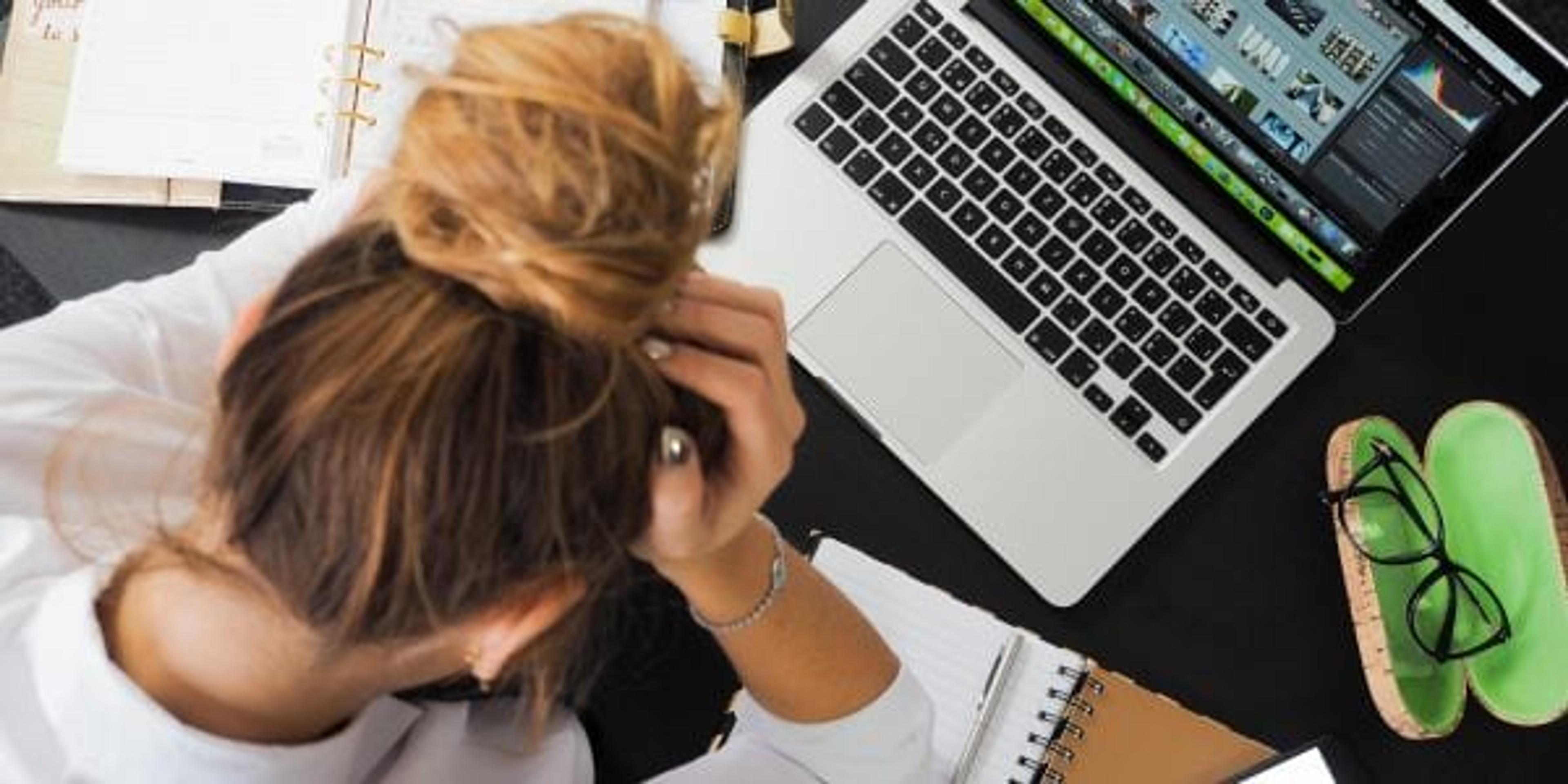 Woman stressed at her desk