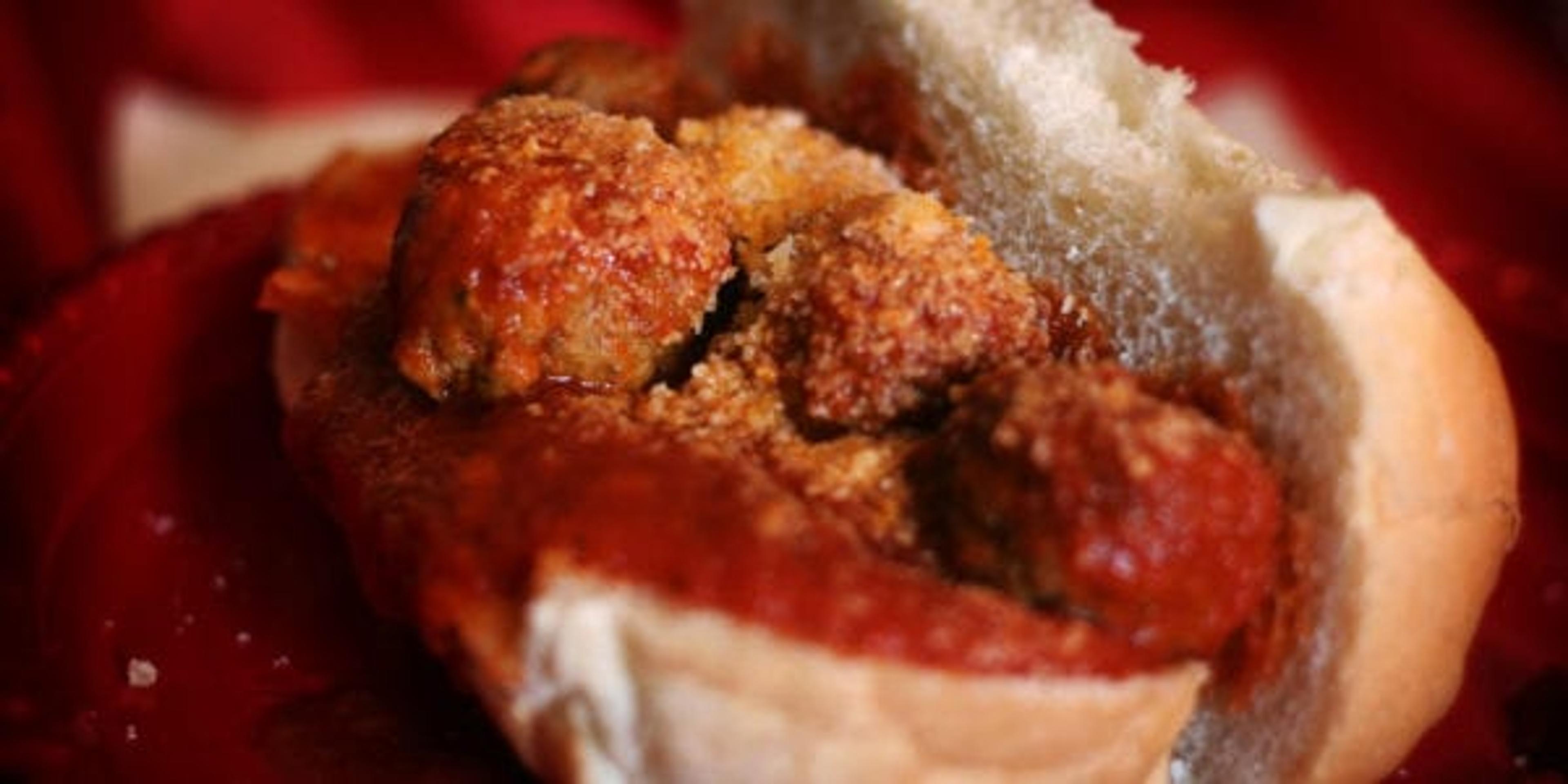 Meatball sandwich on a plate.