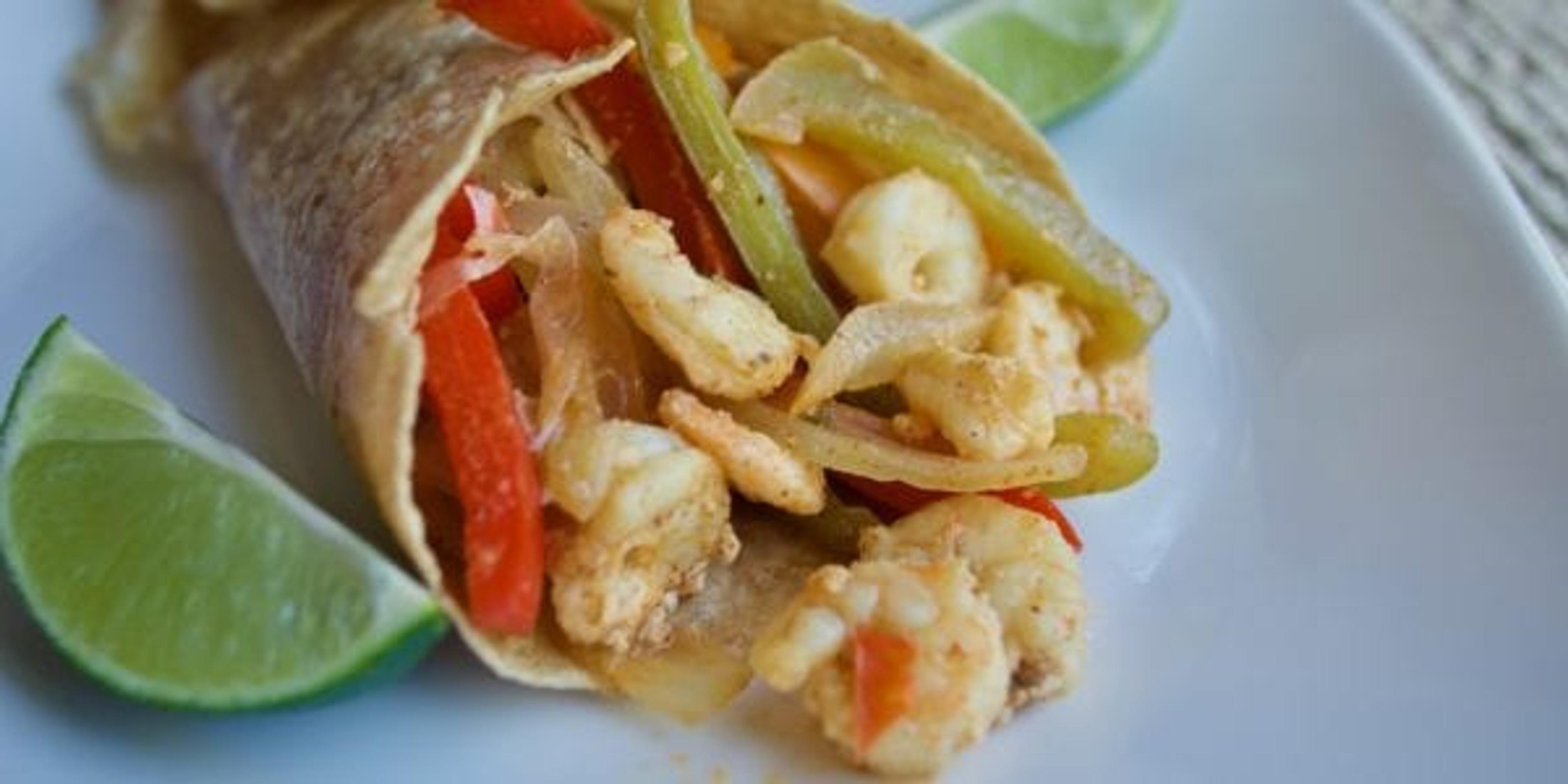 shrimp fajita on plate with lime