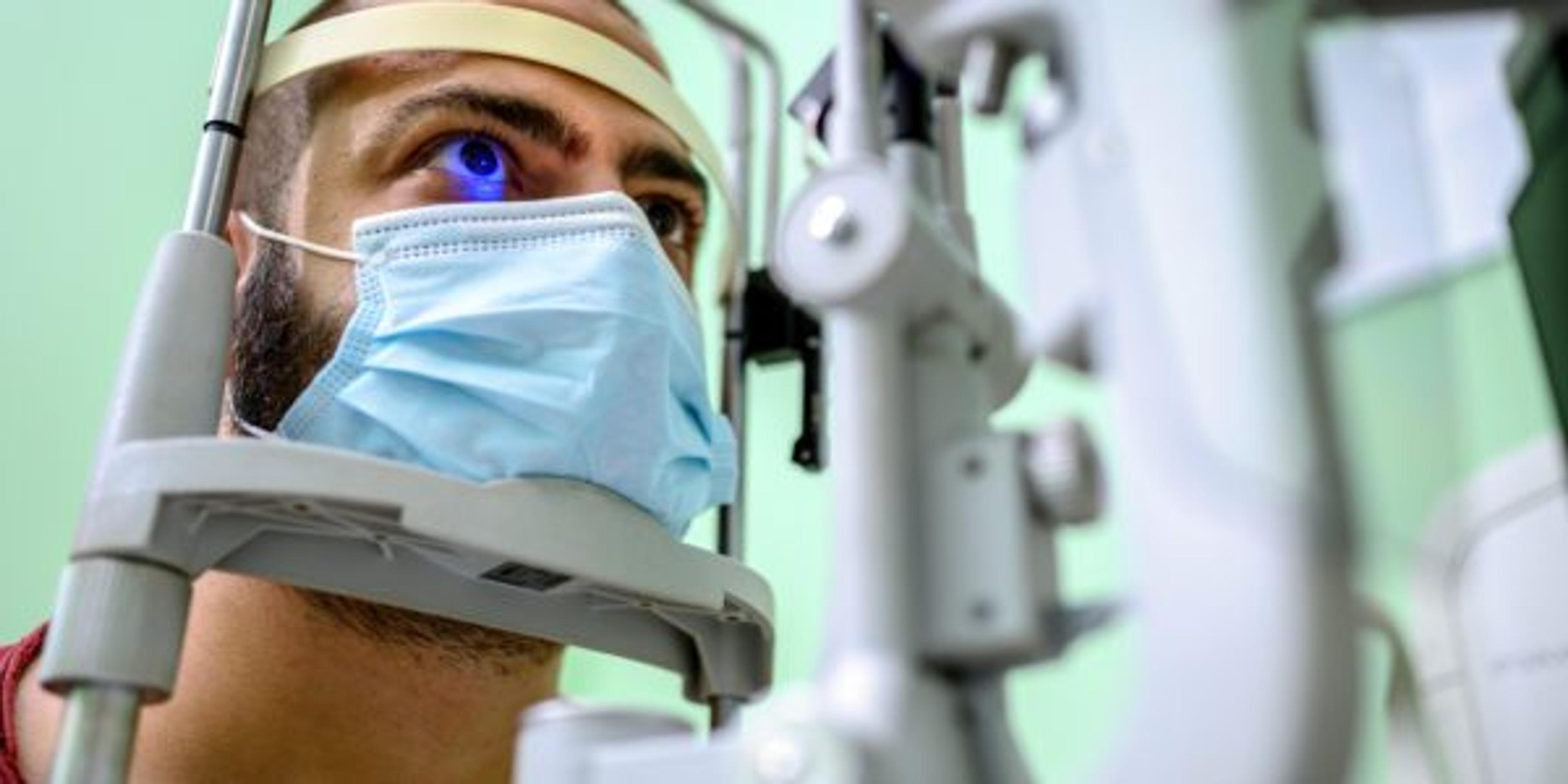 Man having an eye exam at ophthalmologist's office