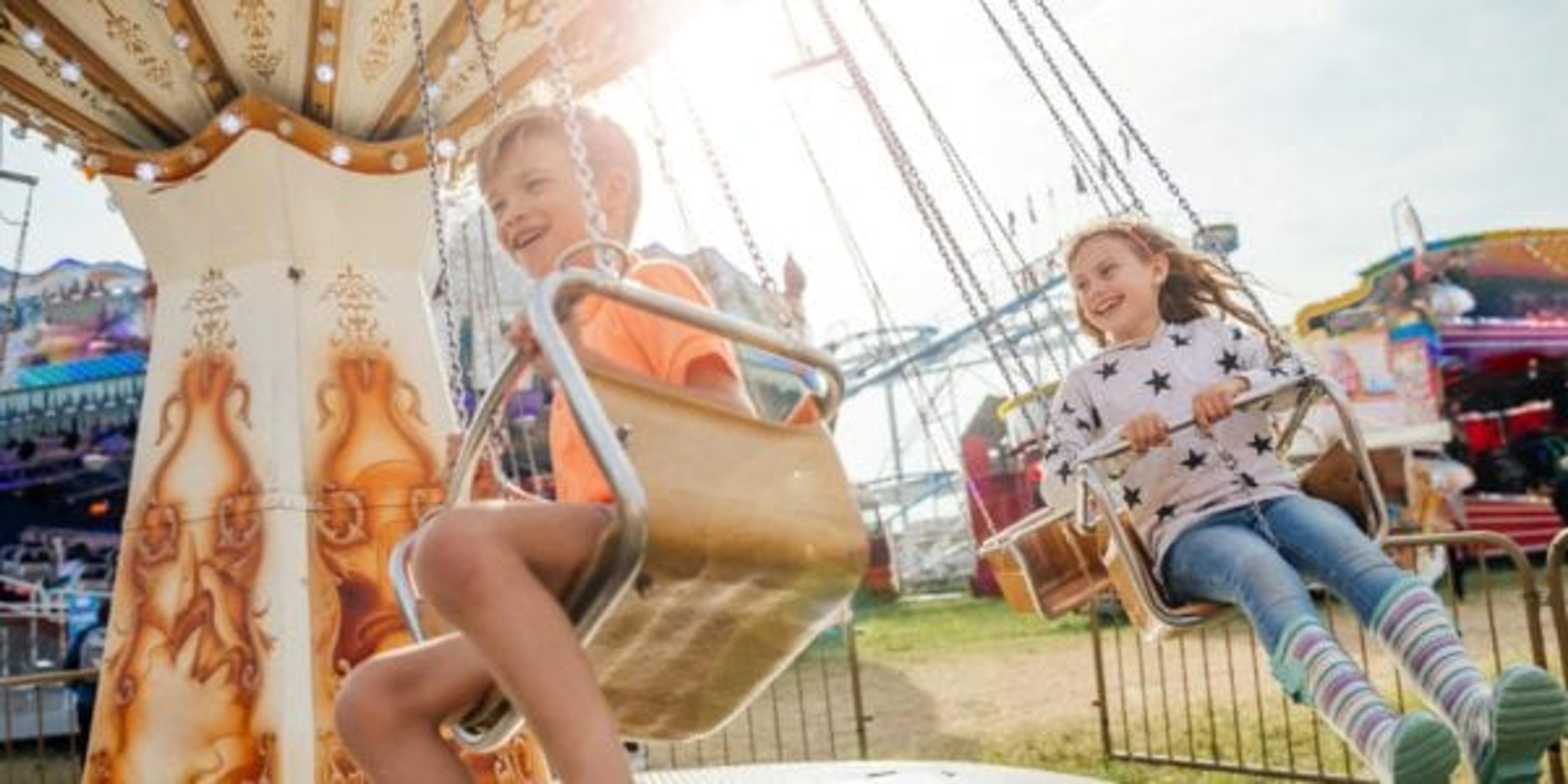 Kids swinging on carnival ride