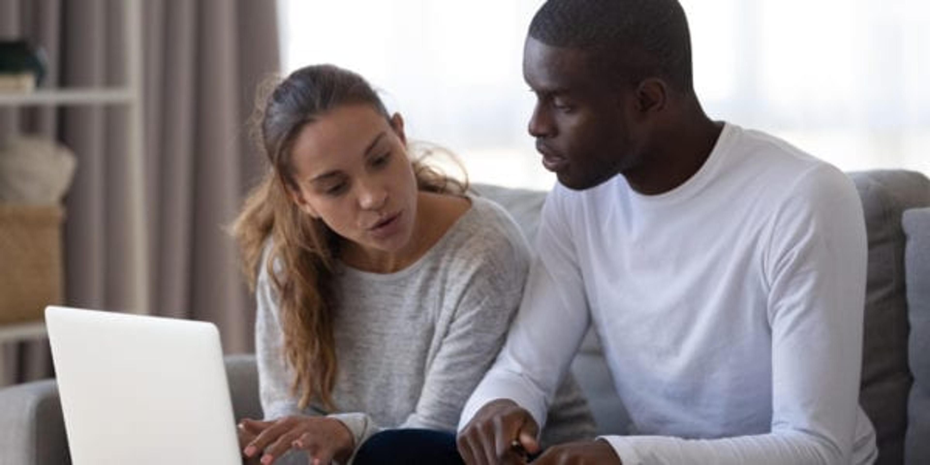 Young couple working on taxes together