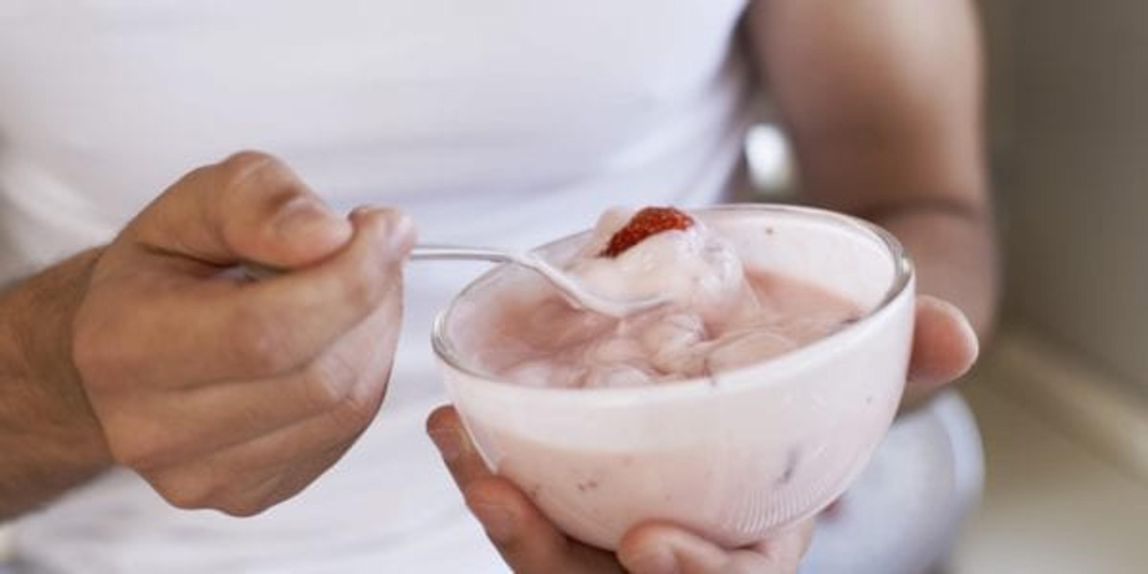 Woman eating yogurt