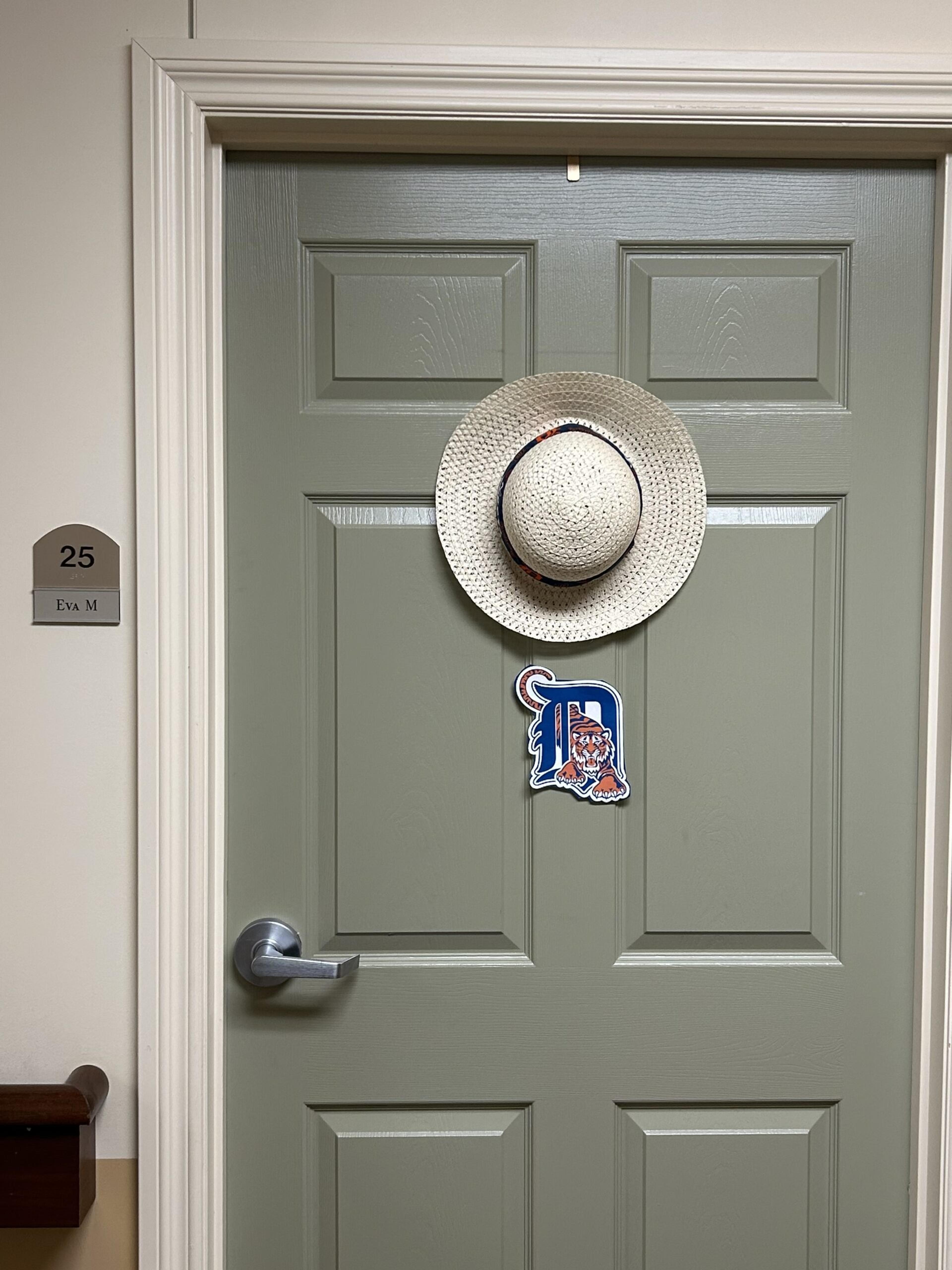 The door to Eva Martin's room at Crestwood Village Assisted Living features a vintage Detroit Tigers logo.