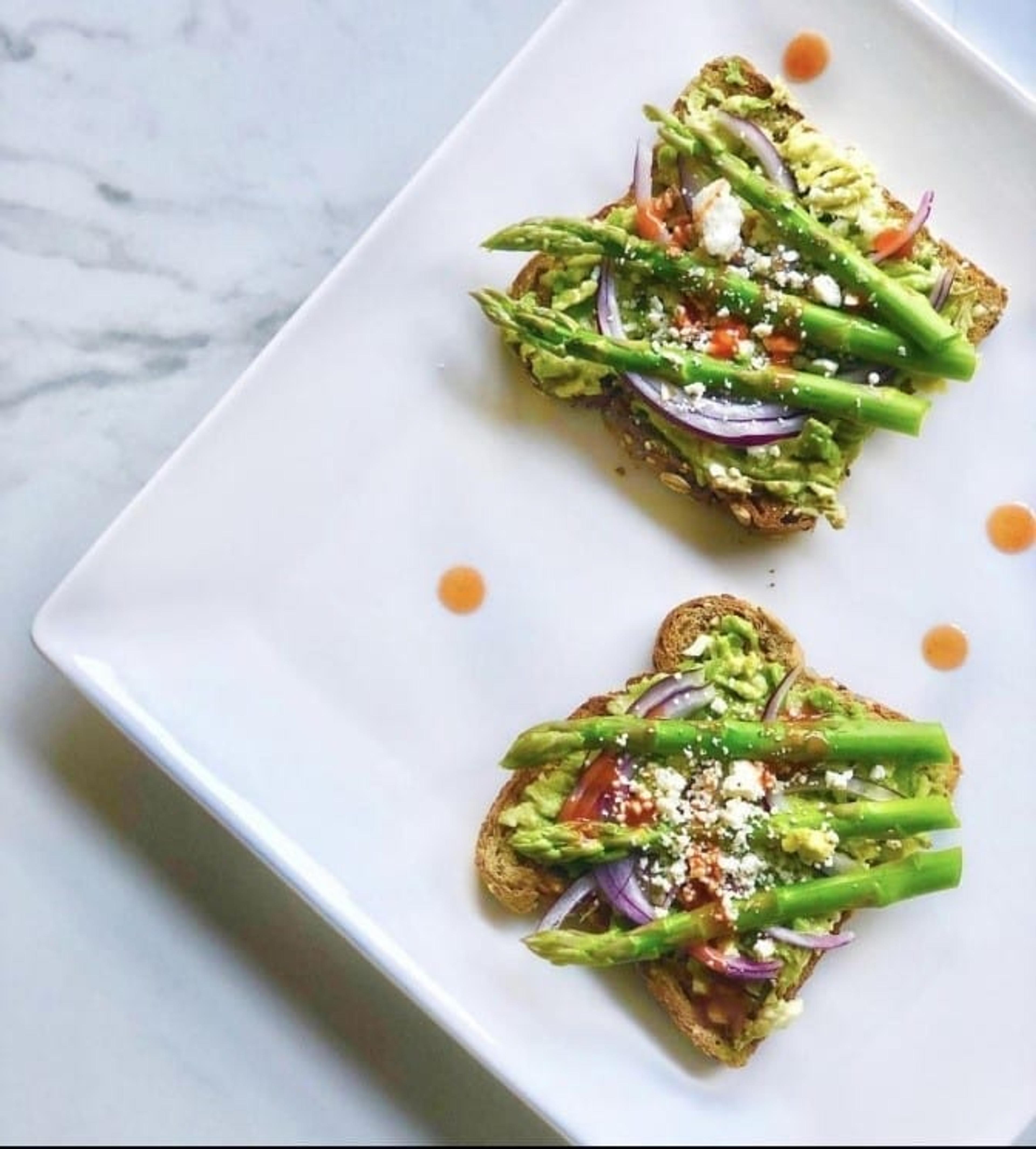 Veggies and toppings on whole wheat bread