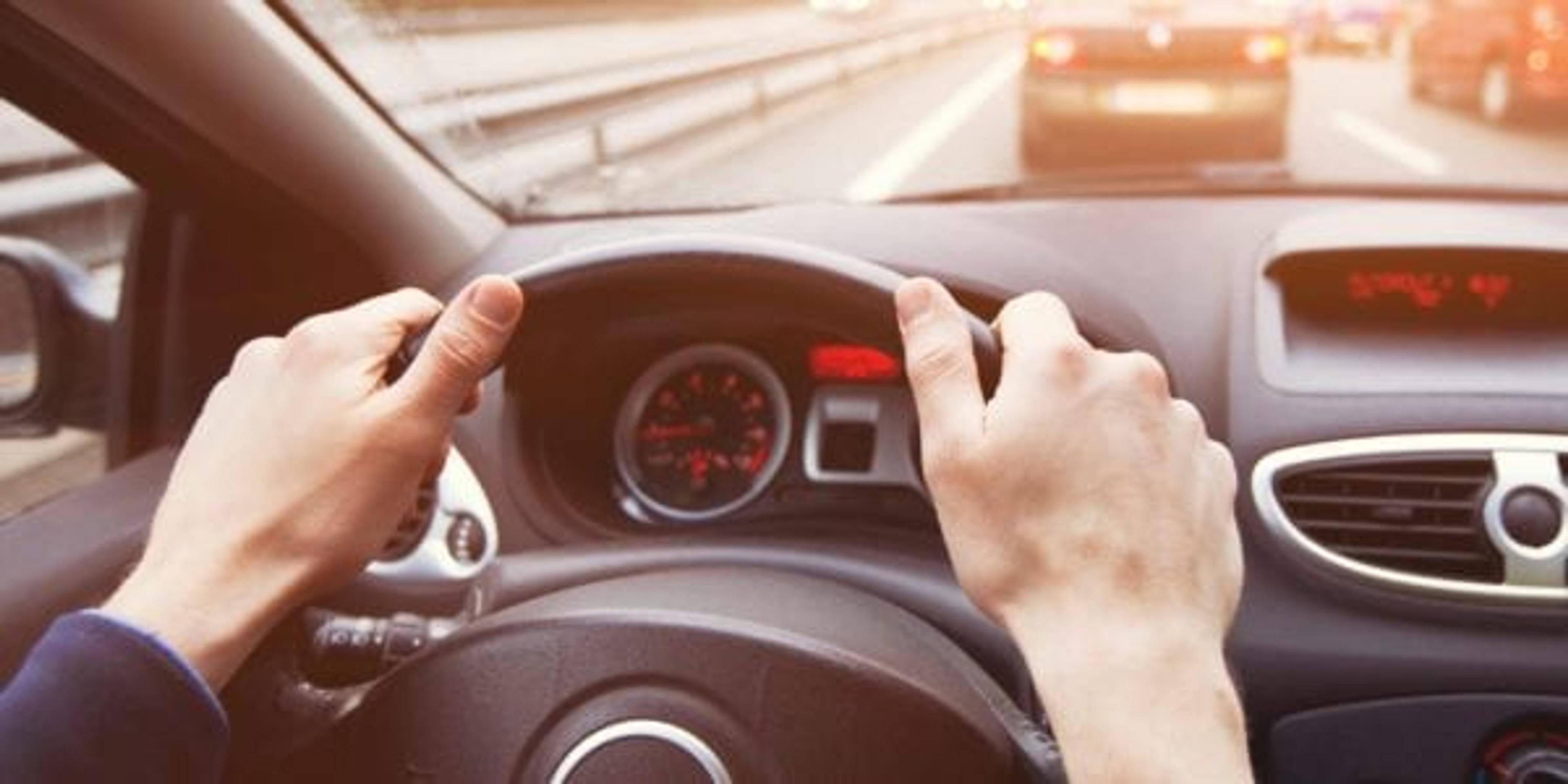 Hands on a steering wheel