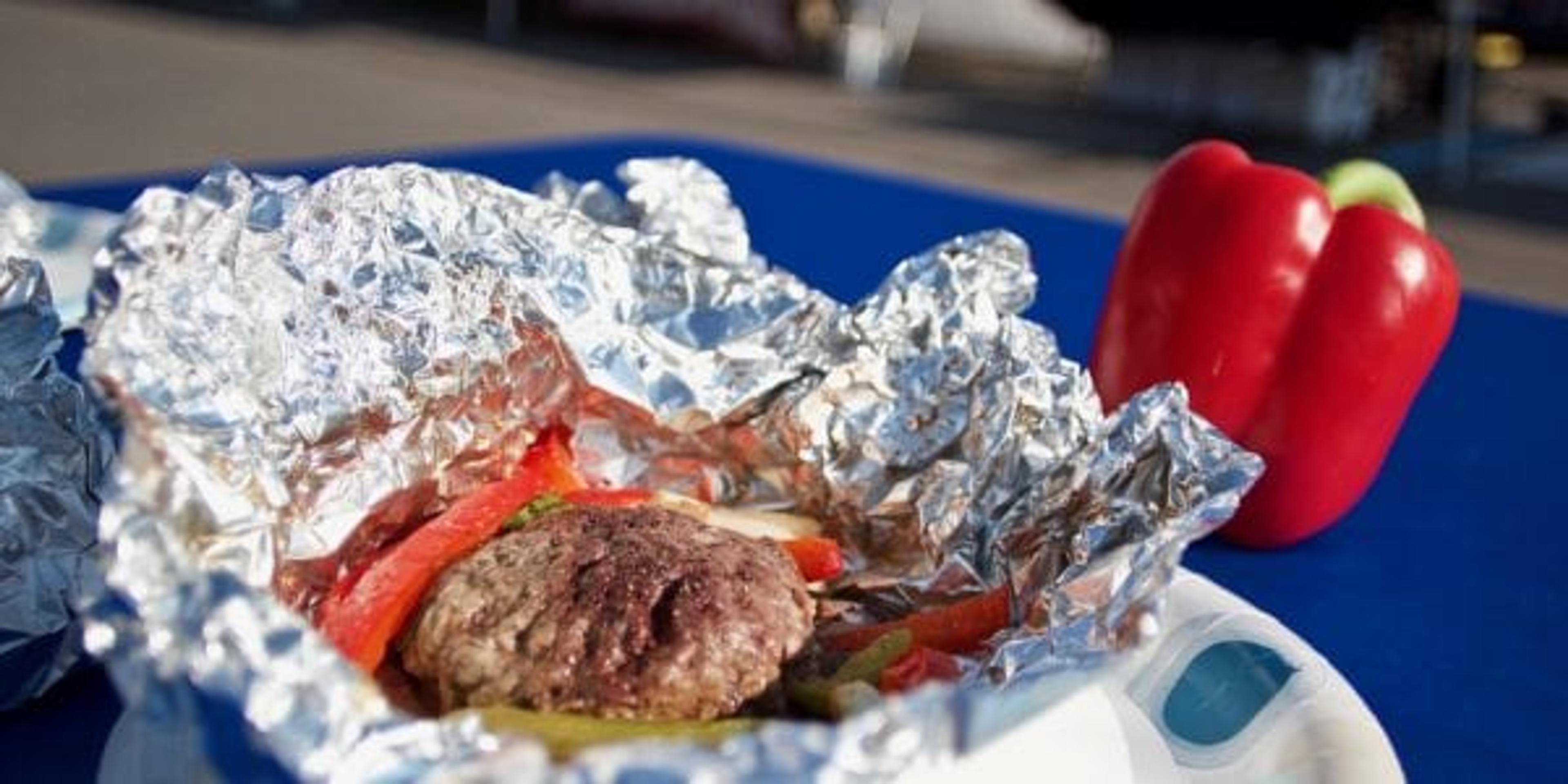 Foil pack on a table with a red pepper.
