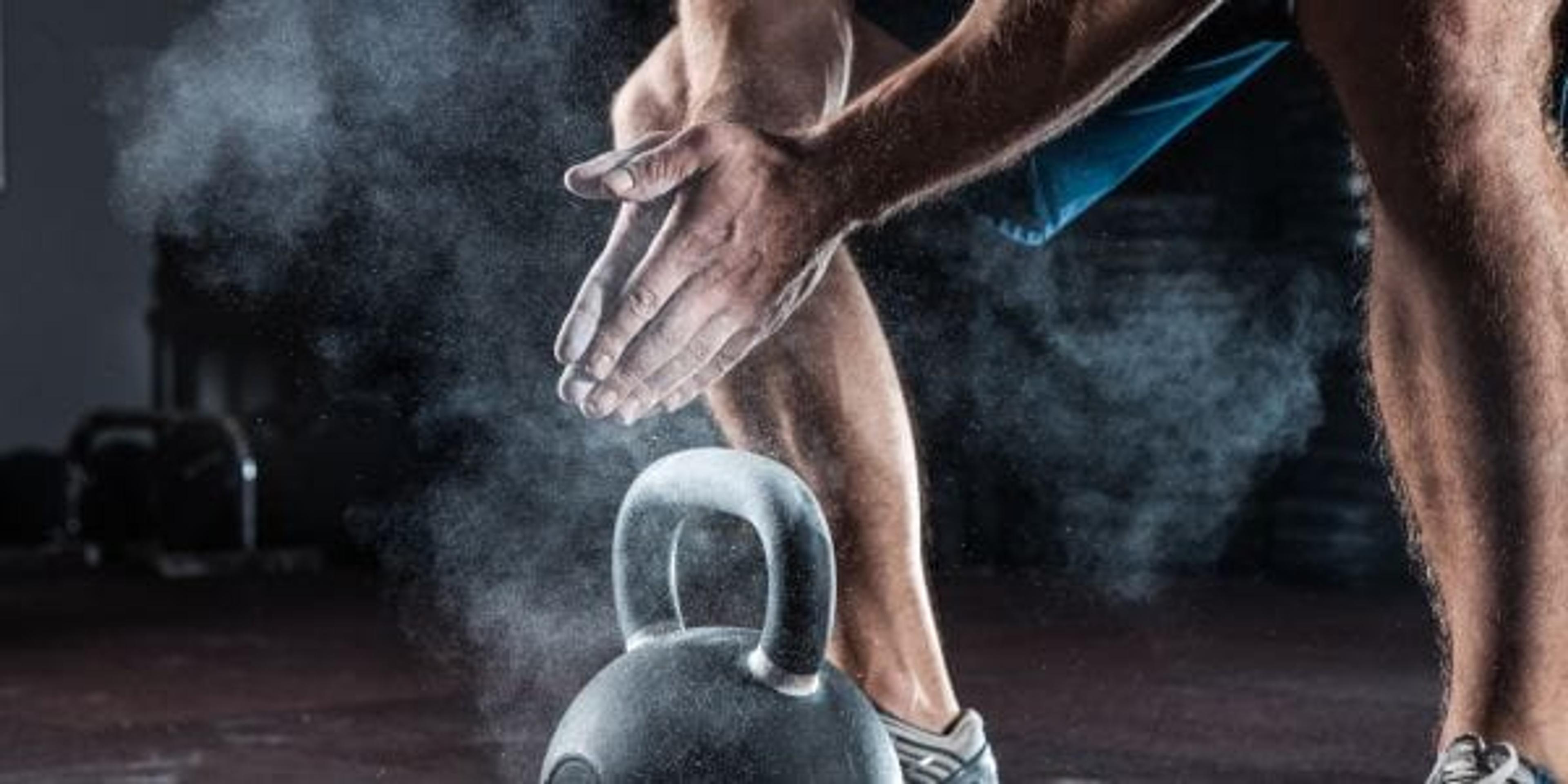 Young athlete ready for a workout with kettlebell.