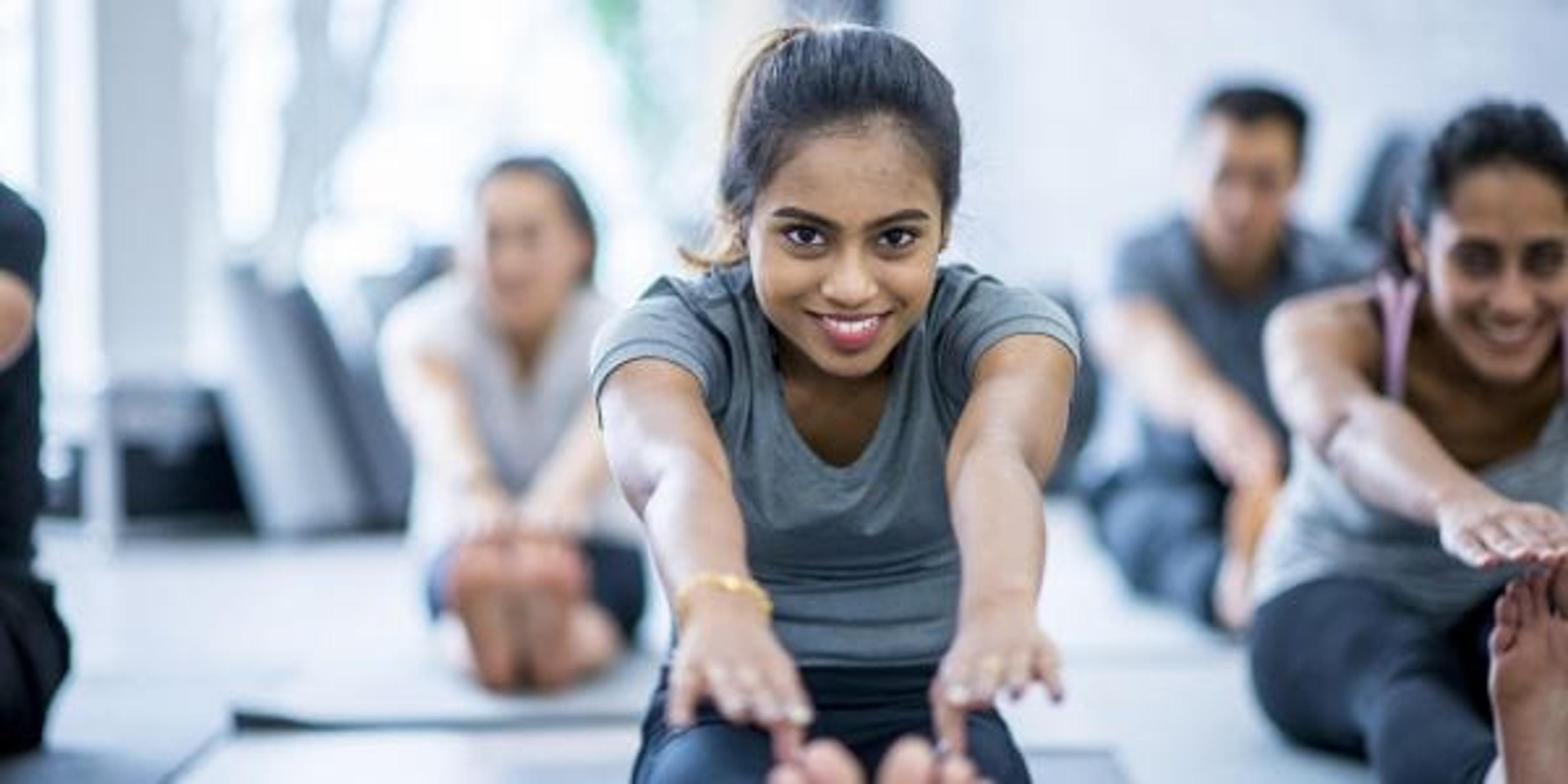 Woman stretching in yoga class