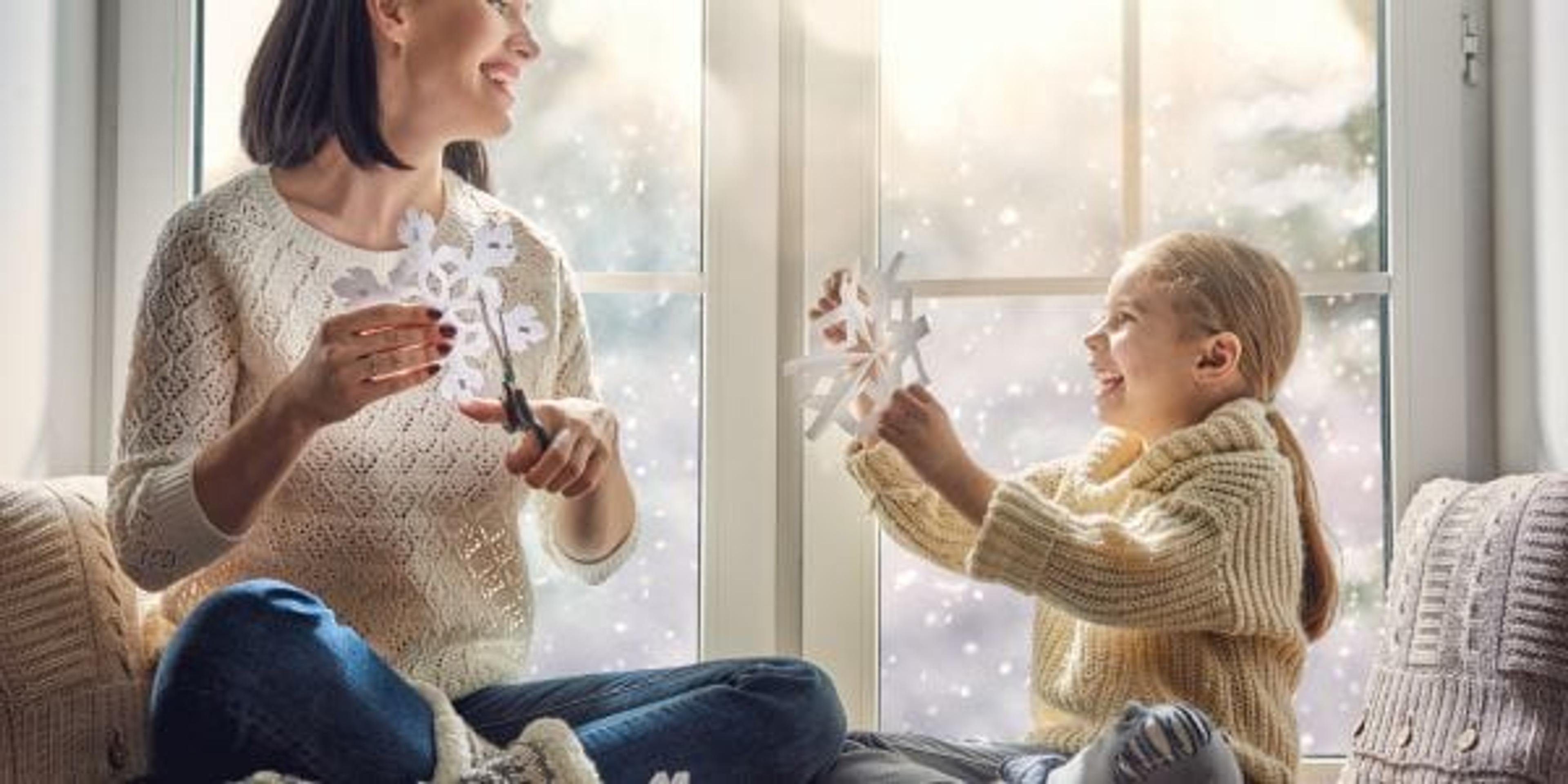 family sitting by the window