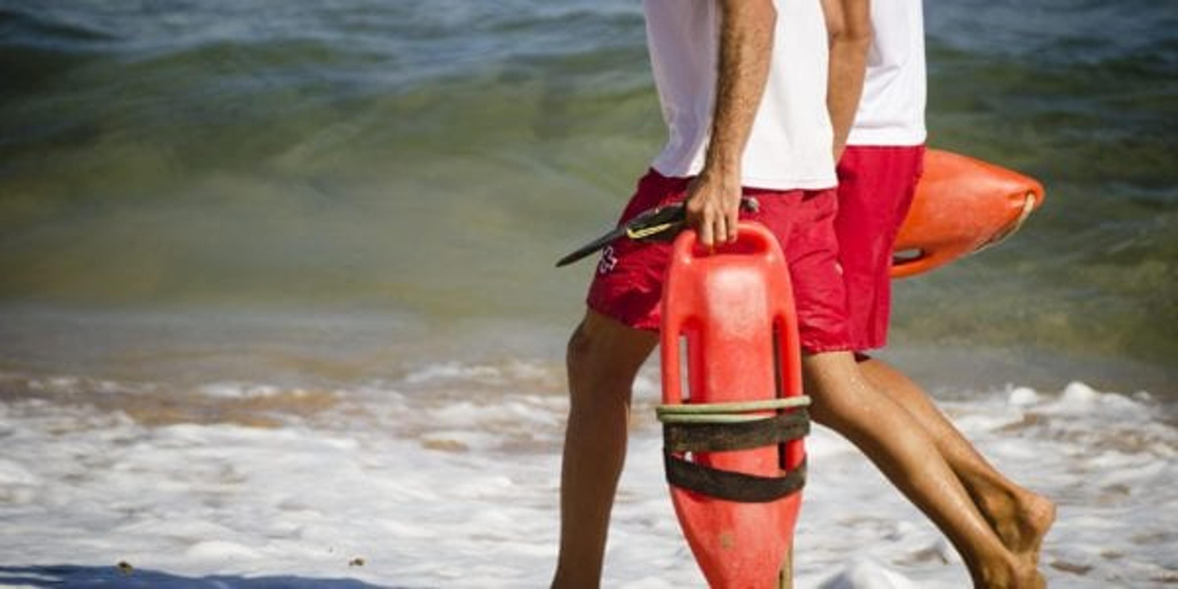 Lifeguards walking on the beach