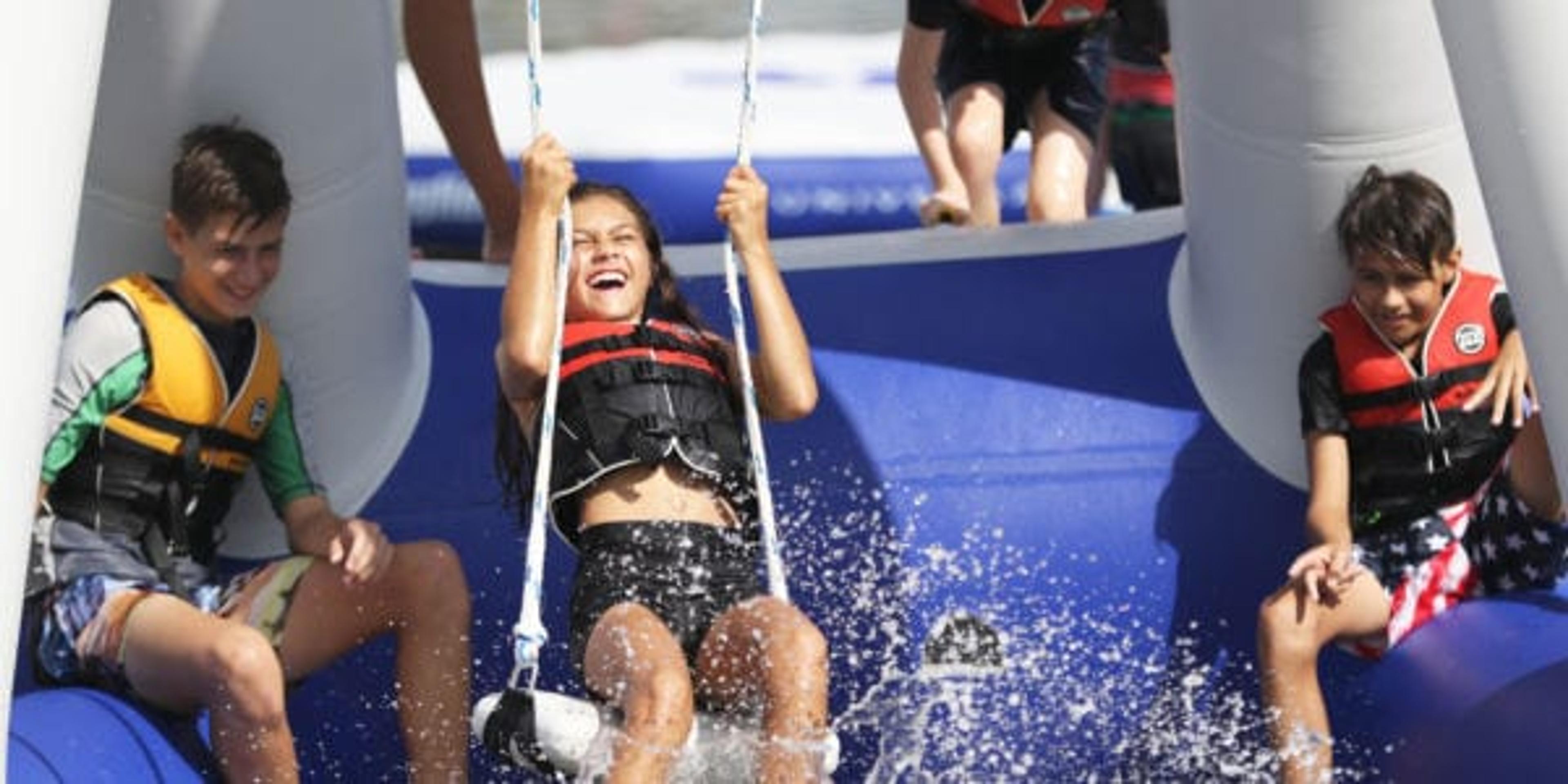 Children play at the Water Warrior Island aquatic park