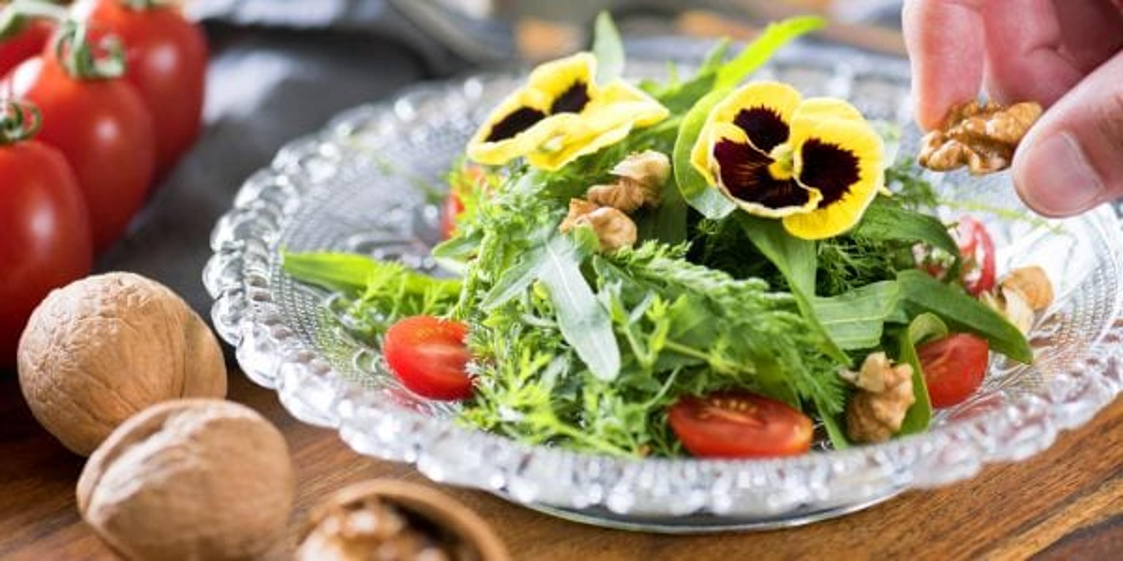 Salad with edible flowers on top