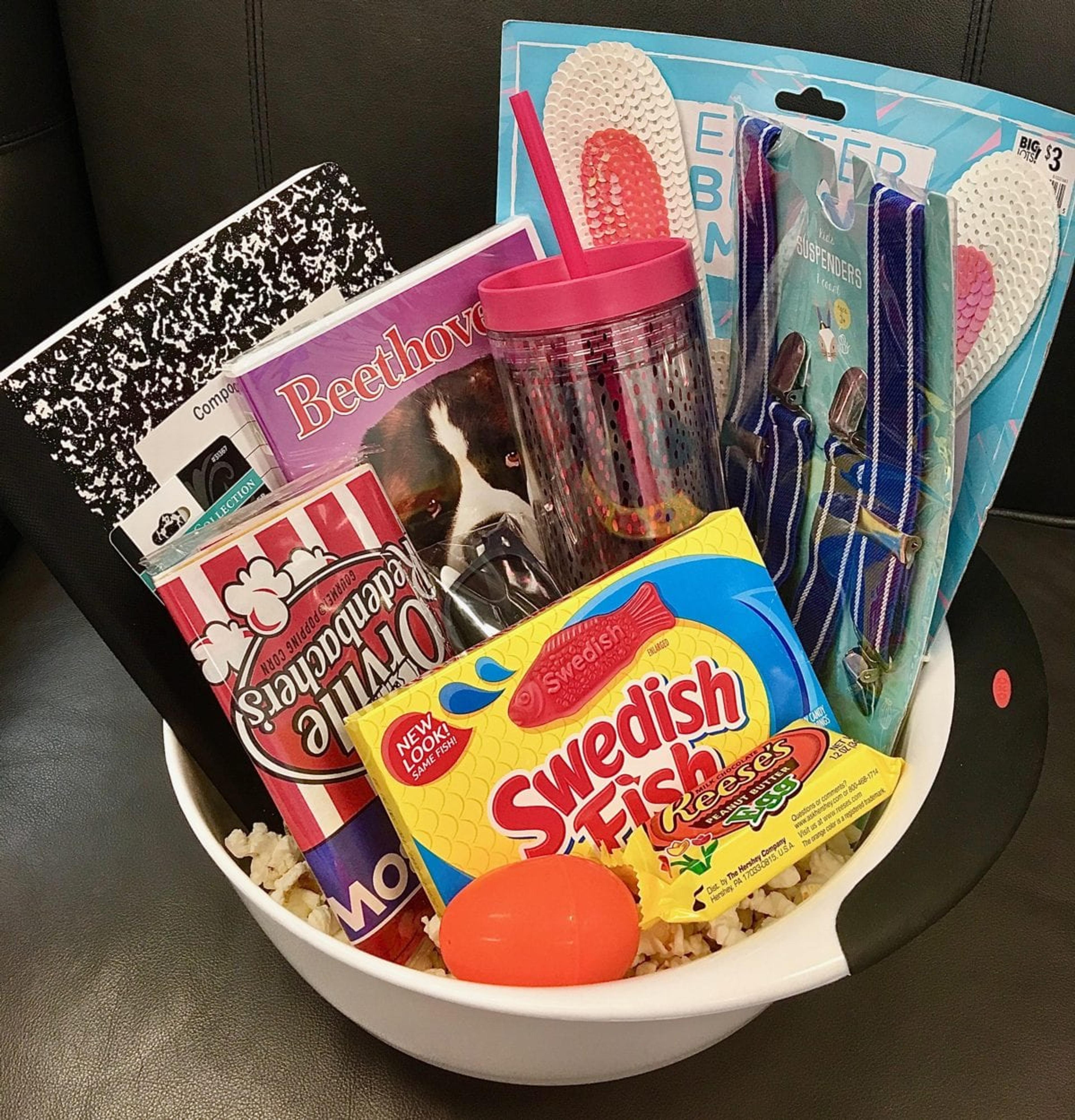 Movie themed easter basket with popcorn and movies