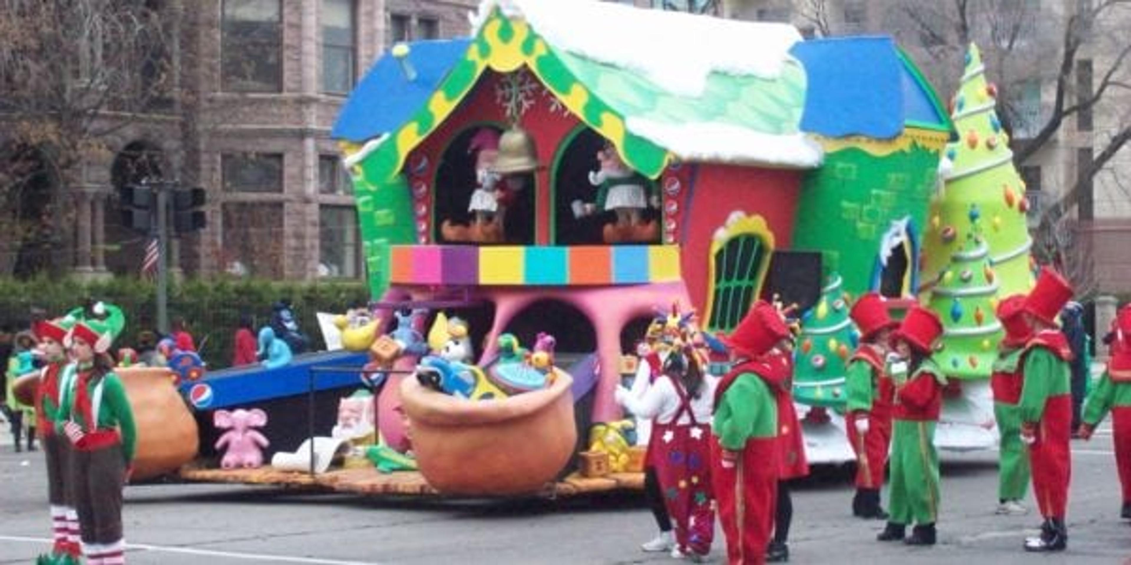 Toy Shop float with people dressed as elves at Thanksgiving Parade
