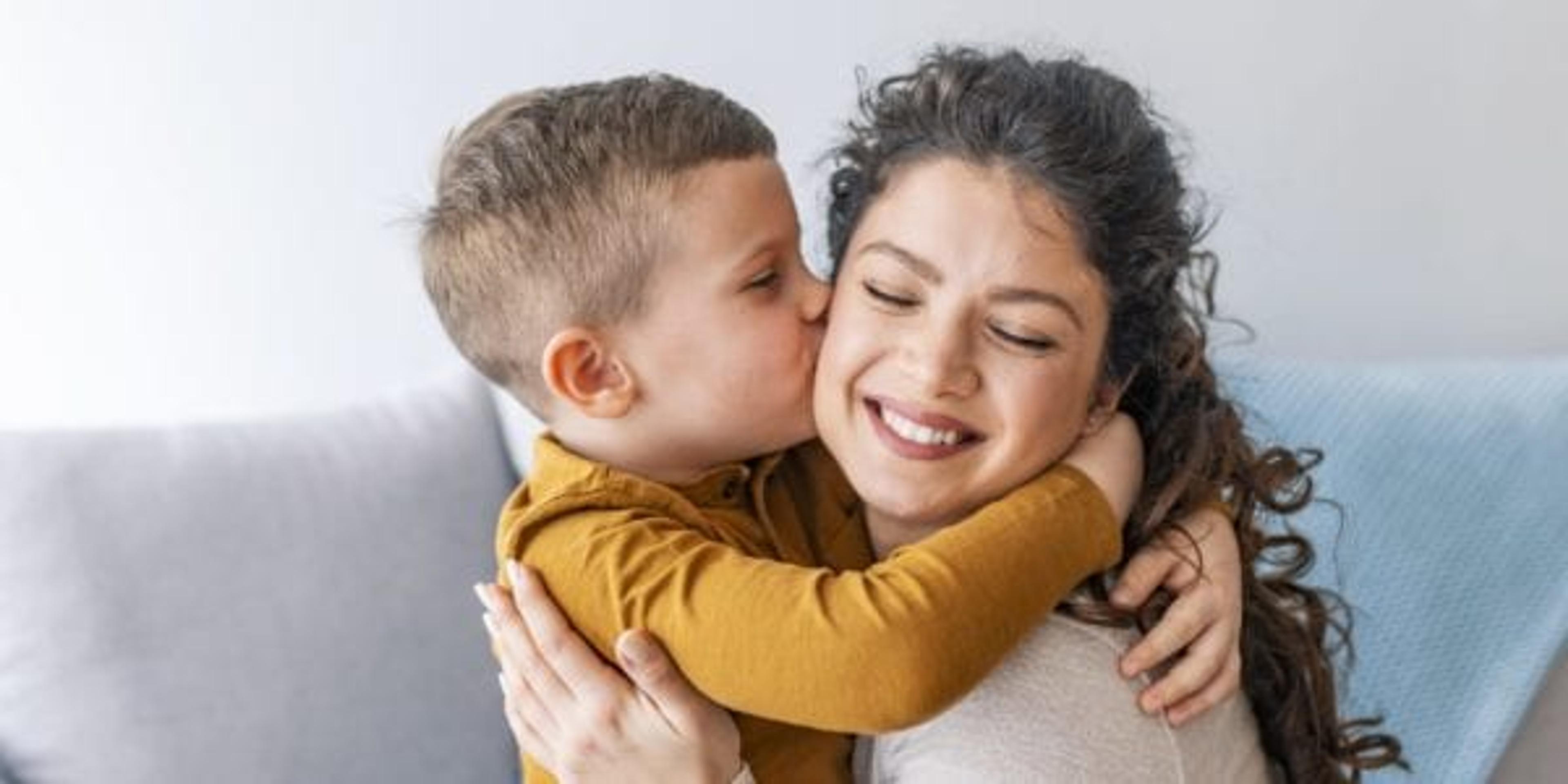 Son kissing mother