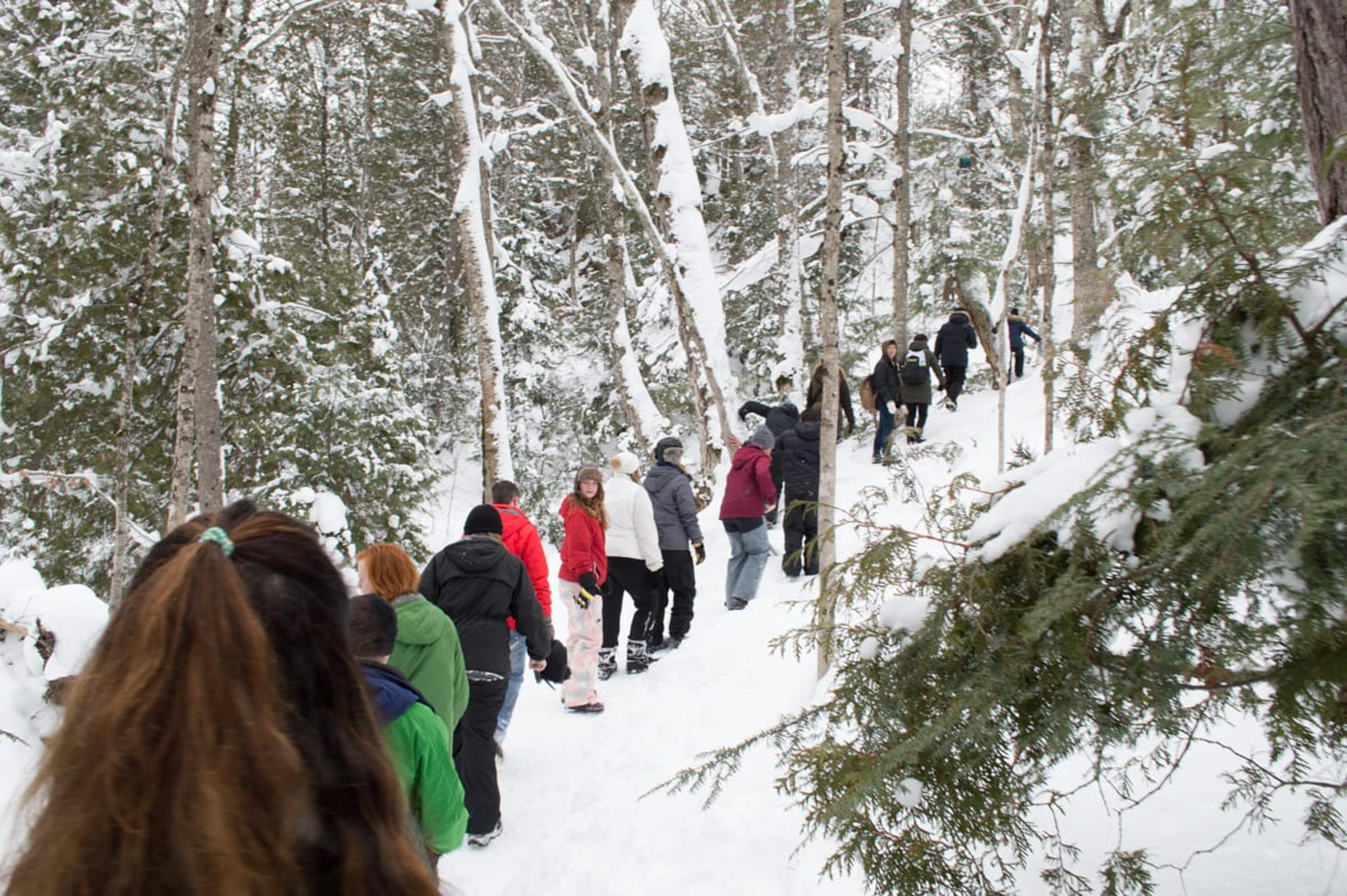 A group of hikers on the trail to the Eben Ice Caves through the Hiawatha National Forest.